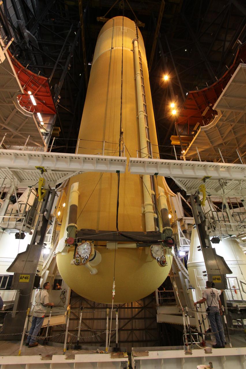 CAPE CANAVERAL, Fla. – In the Vehicle Assembly Building at NASA's Kennedy Space Center in Florida, the external tank for space shuttle Endeavour's STS-130 mission, ET-134, is lowered into High Bay-1 where it will be mated with the twin solid rocket boosters that will be used on the mission. Endeavour's move, or "rollover," from Orbiter Processing Facility-2 is targeted for Dec. 12. The Tranquility module, the payload for the STS-130 mission to the International Space Station, will be installed in the payload bay after the shuttle has reached the pad. Endeavour's launch is targeted for Feb. 4, 2010. For information on the STS-130 mission and crew, visit http://www.nasa.gov/mission_pages/shuttle/shuttlemissions/sts130/index.html. Photo credit: NASA/Jack Pfaller