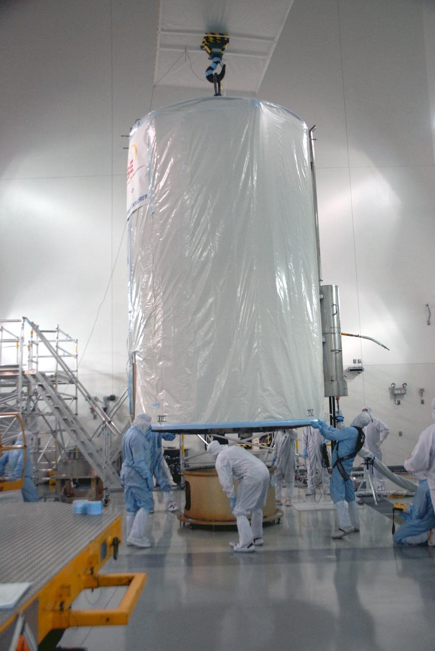 VANDENBERG AIR FORCE BASE, Calif. - At the Astrotech payload processing facility at Vandenberg Air Force Base in California, spacecraft technicians supervise the lift of a transportation canister containing NASA's Wide-field Infrared Survey Explorer, or WISE, from a work stand for its move to Space Launch Complex 2.    WISE will survey the entire sky at infrared wavelengths, creating a cosmic clearinghouse of hundreds of millions of objects which will be catalogued and provide a vast storehouse of knowledge about the solar system, the Milky Way, and the universe. Launch aboard a United Launch Alliance Delta II rocket is scheduled for Dec. 9.  For additional information, visit http://www.nasa.gov/wise.  Photo credit: NASA/Daniel Liberotti, VAFB