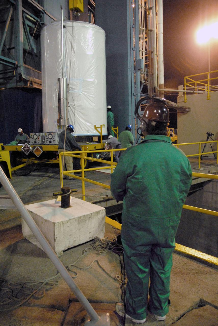 VANDENBERG AIR FORCE BASE, Calif. - Spacecraft technicians begin to offload NASA's Wide-field Infrared Survey Explorer, or WISE, enclosed in a transportation canister, upon its arrival at Space Launch Complex 2 at Vandenberg Air Force Base in California.    WISE will survey the entire sky at infrared wavelengths, creating a cosmic clearinghouse of hundreds of millions of objects which will be catalogued and provide a vast storehouse of knowledge about the solar system, the Milky Way, and the universe. Launch is scheduled for Dec. 9.  For additional information, visit http://www.nasa.gov/wise.  Photo credit: NASA/Mark Mackley, VAFB