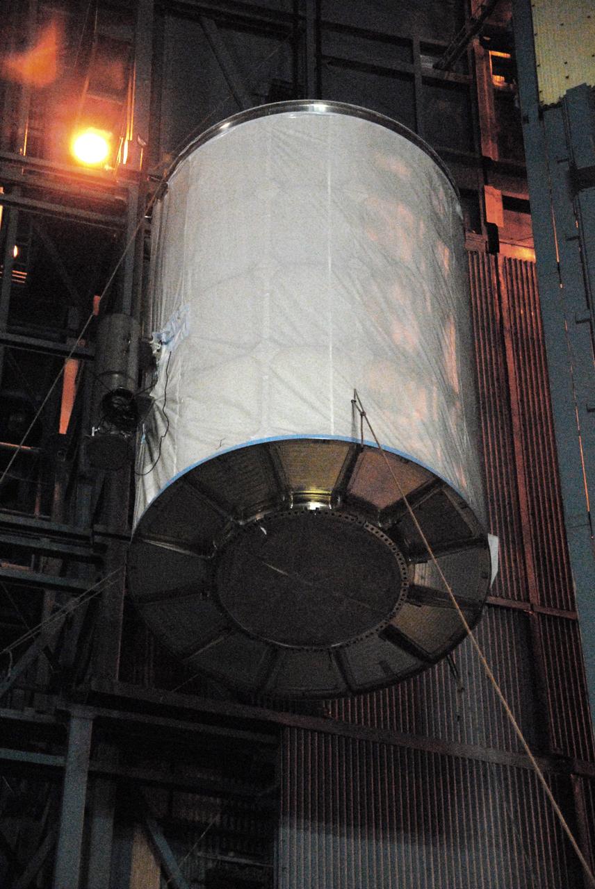 VANDENBERG AIR FORCE BASE, Calif. - NASA's Wide-field Infrared Survey Explorer, or WISE, enclosed in a transportation canister, climbs up the side of the mobile launch tower at Space Launch Complex 2 at Vandenberg Air Force Base in California.    WISE will survey the entire sky at infrared wavelengths, creating a cosmic clearinghouse of hundreds of millions of objects which will be catalogued and provide a vast storehouse of knowledge about the solar system, the Milky Way, and the universe. Launch is scheduled for Dec. 9.  For additional information, visit http://www.nasa.gov/wise.  Photo credit: NASA/Mark Mackley, VAFB