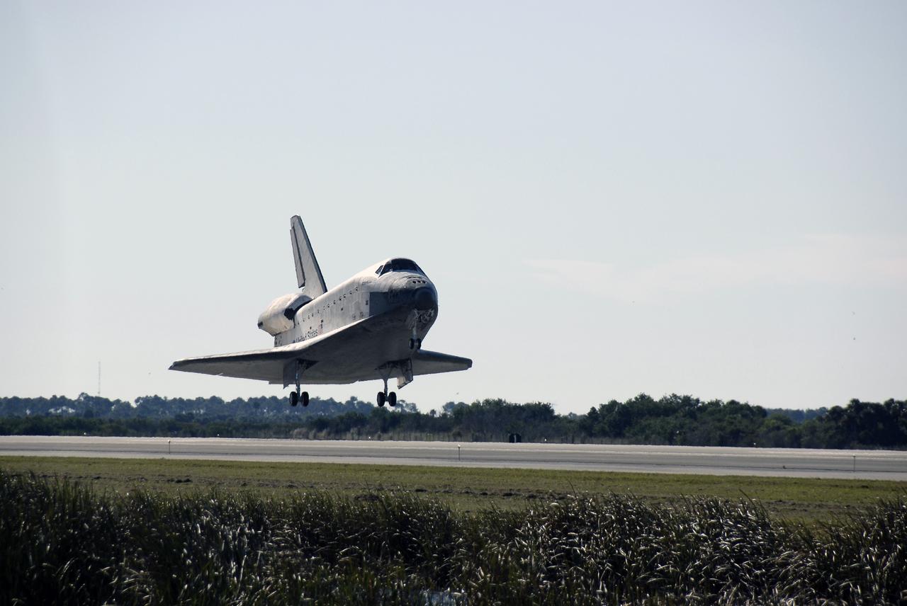 CAPE CANAVERAL, Fla. - With landing gear down, space shuttle Atlantis approaches landing on Runway 33 at the Shuttle Landing Facility at NASA's Kennedy Space Center in Florida after 11 days in space, completing the 4.5-million mile STS-129 mission on orbit 171. Main gear touchdown was at 9:44:23 a.m. EST. Nose gear touchdown was at 9:44:36 a.m., and wheels stop was at 9:45:05 a.m. Aboard Atlantis are Commander Charles O. Hobaugh; Pilot Barry E. Wilmore; Mission Specialists Leland Melvin, Randy Bresnik, Mike Foreman and Robert L. Satcher Jr.; and Expedition 20 and 21 Flight Engineer Nicole Stott who spent 87 days aboard the International Space Station. STS-129 is the final space shuttle Expedition crew rotation flight on the manifest. On STS-129, the crew delivered 14 tons of cargo to the orbiting laboratory, including two ExPRESS Logistics Carriers containing spare parts to sustain station operations after the shuttles are retired next year. For information on the STS-129 mission and crew, visit http://www.nasa.gov/mission_pages/shuttle/shuttlemissions/sts129/index.html. Photo credit: NASA/Kim Shiflett