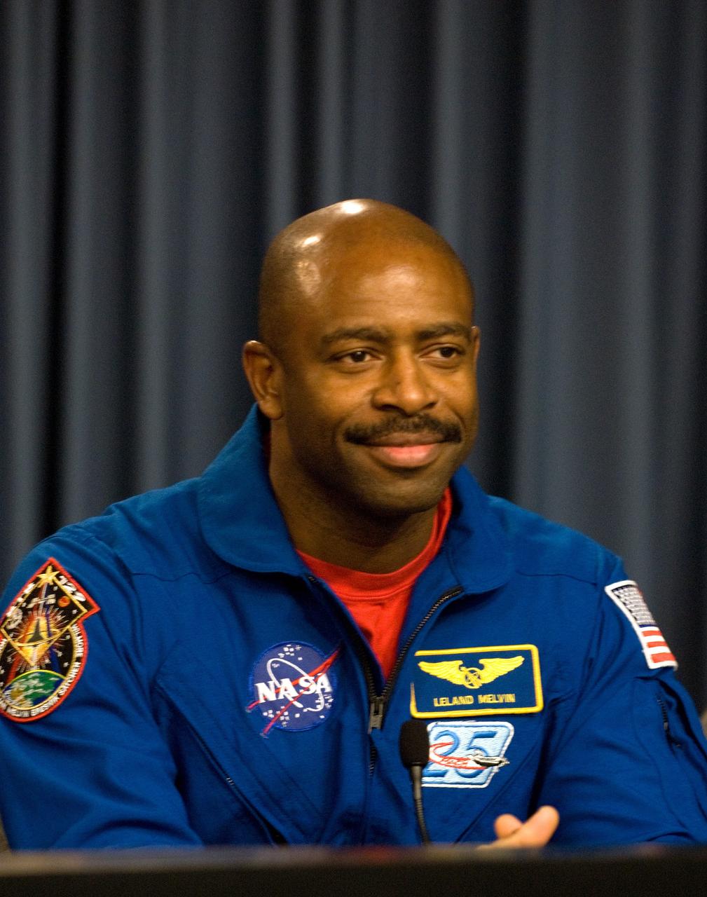 CAPE CANAVERAL, Fla. - STS-129 Mission Specialist Leland Melvin participates in a news conference in the NASA Press Site auditorium at NASA's Kennedy Space Center in Florida on landing day. Space shuttle Atlantis' main gear touchdown on Kennedy's Shuttle Landing Facility was at 9:44:23 a.m. EST. Nose gear touchdown was at 9:44:36 a.m., and wheels stop was at 9:45:05 a.m. STS-129 is the final space shuttle Expedition crew rotation flight on the manifest. On STS-129, the crew delivered 14 tons of cargo to the orbiting laboratory, including two ExPRESS Logistics Carriers containing spare parts to sustain station operations after the shuttles are retired next year. For information on the STS-129 mission and crew, visit http://www.nasa.gov/mission_pages/shuttle/shuttlemissions/sts129/index.html. Photo credit: NASA/Kim Shiflett