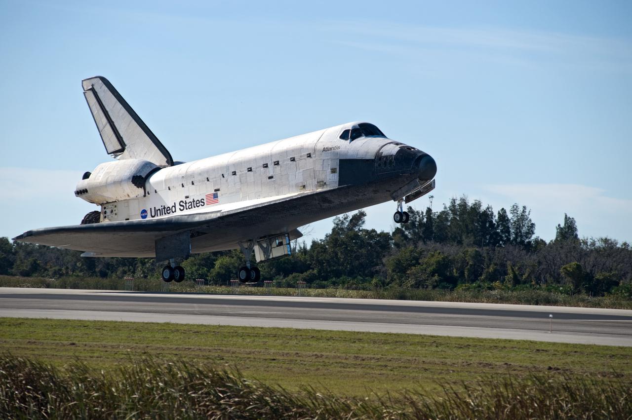 CAPE CANAVERAL, Fla. - With landing gear down, space shuttle Atlantis approaches landing on Runway 33 at the Shuttle Landing Facility at NASA's Kennedy Space Center in Florida after 11 days in space, completing the 4.5-million mile STS-129 mission on orbit 171. Main gear touchdown was at 9:44:23 a.m. EST. Nose gear touchdown was at 9:44:36 a.m., and wheels stop was at 9:45:05 a.m. Aboard Atlantis are Commander Charles O. Hobaugh; Pilot Barry E. Wilmore; Mission Specialists Leland Melvin, Randy Bresnik, Mike Foreman and Robert L. Satcher Jr.; and Expedition 20 and 21 Flight Engineer Nicole Stott who spent 87 days aboard the International Space Station. STS-129 is the final space shuttle Expedition crew rotation flight on the manifest. On STS-129, the crew delivered 14 tons of cargo to the orbiting laboratory, including two ExPRESS Logistics Carriers containing spare parts to sustain station operations after the shuttles are retired next year. For information on the STS-129 mission and crew, visit http://www.nasa.gov/mission_pages/shuttle/shuttlemissions/sts129/index.html. Photo credit: NASA/Tom Joseph