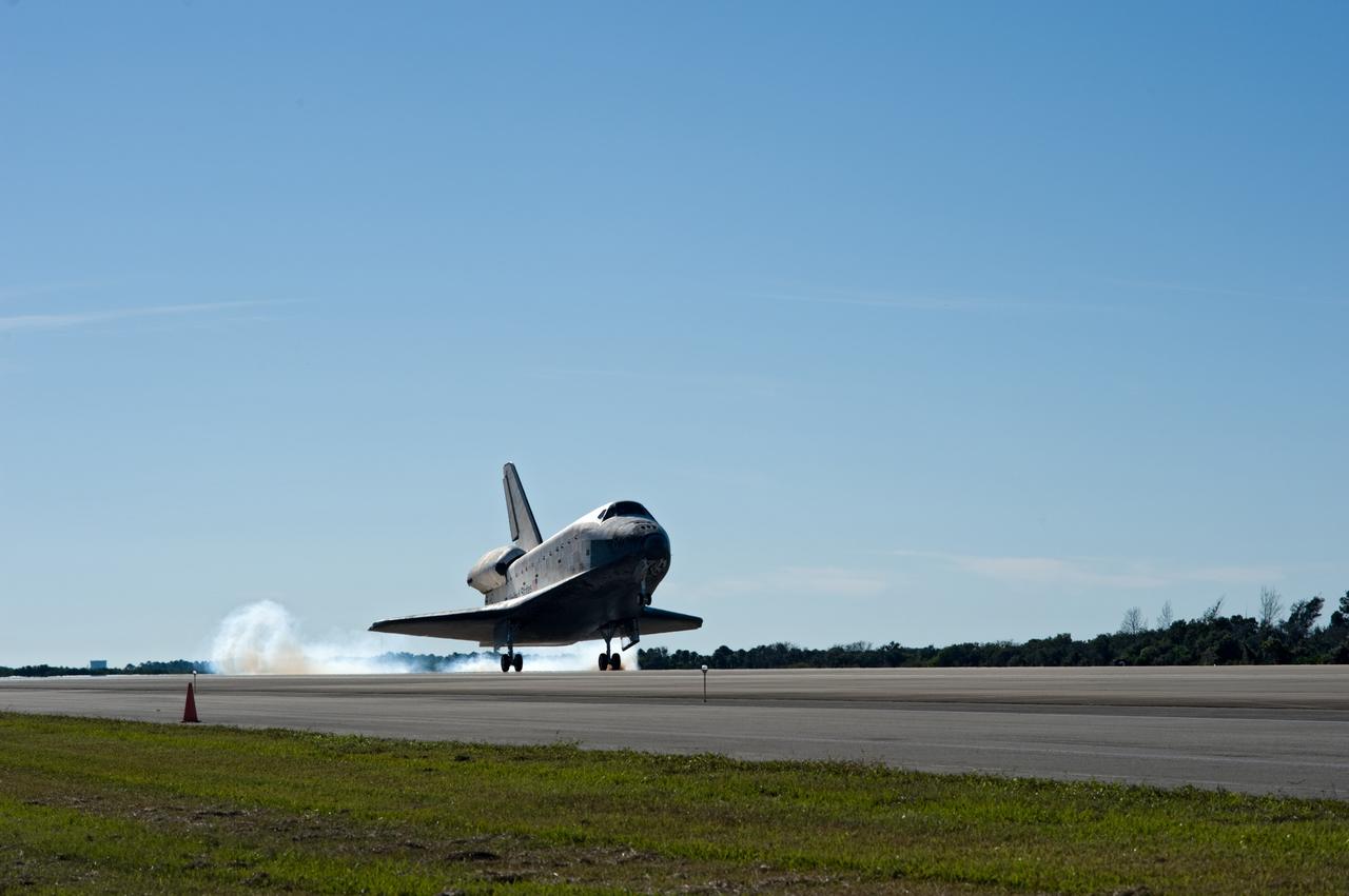 CAPE CANAVERAL, Fla. - Touchdown is apparent by the streams of smoke trailing space shuttle Atlantis as its main landing gear tires contact Runway 33 at the Shuttle Landing Facility at NASA's Kennedy Space Center in Florida. After 11 days in space, Atlantis' 4.5-million-mile STS-129 mission is completed on orbit 171. Main gear touchdown was at 9:44:23 a.m. EST. Nose gear touchdown was at 9:44:36 a.m., and wheels stop was at 9:45:05 a.m. Aboard Atlantis are Commander Charles O. Hobaugh; Pilot Barry E. Wilmore; Mission Specialists Leland Melvin, Randy Bresnik, Mike Foreman and Robert L. Satcher Jr.; and Expedition 20 and 21 Flight Engineer Nicole Stott who spent 87 days aboard the International Space Station. STS-129 is the final space shuttle Expedition crew rotation flight on the manifest. On STS-129, the crew delivered 14 tons of cargo to the orbiting laboratory, including two ExPRESS Logistics Carriers containing spare parts to sustain station operations after the shuttles are retired next year. For information on the STS-129 mission and crew, visit http://www.nasa.gov/mission_pages/shuttle/shuttlemissions/sts129/index.html. Photo credit: NASA/Kevin O'Connell and Rick Prickett