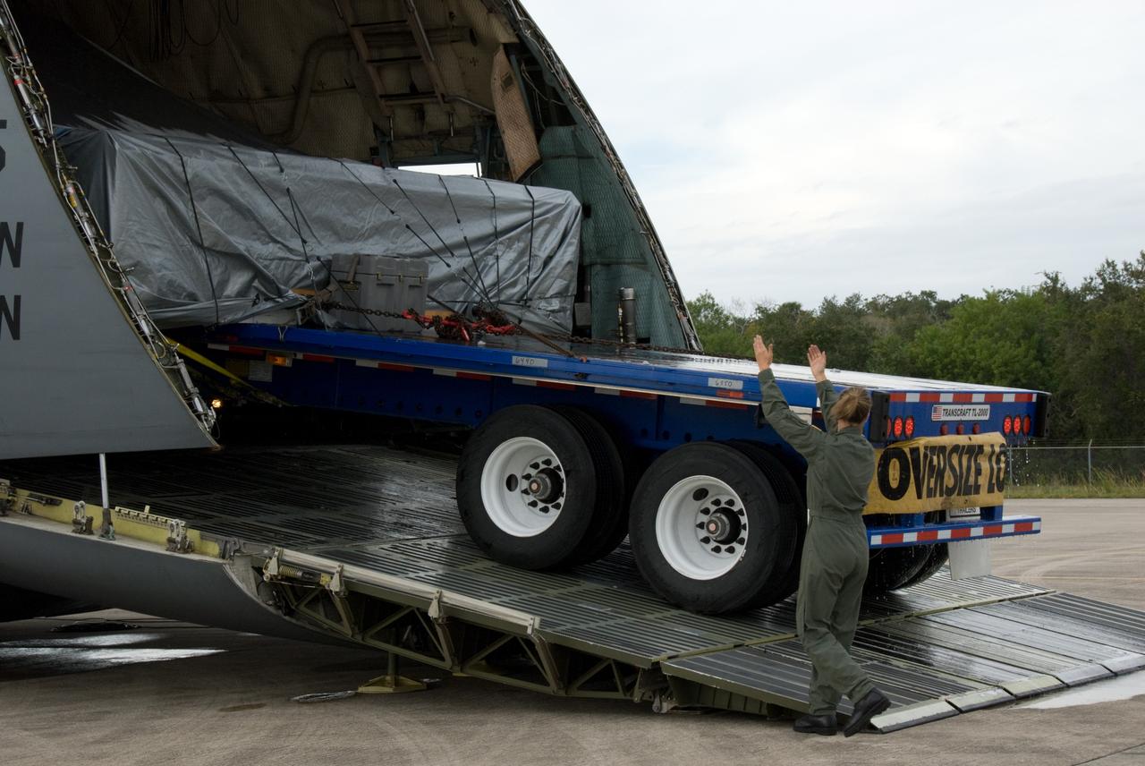 CAPE CANAVERAL, Fla. - At the Shuttle Landing Facility at NASA's Kennedy Space Center in Florida, the ExPRESS Logistics Carrier 3, or ELC-3, is offloaded from a U.S. Air Force C-5 aircraft. ELC-3 and the Alpha Magnetic Spectrometer are the primary payloads for space shuttle Endeavour's STS-134 mission to the International Space Station. The STS-134 crew will also deliver spare parts including two S-band communications antennas, a high pressure gas tank, additional spare parts for Dextre and micrometeoroid debris shields. Endeavour's launch is targeted for July 29, 2010. For information on the STS-134 mission objectives and crew, visit http://www.nasa.gov/shuttle. Photo credit: NASA/Kim Shiflett
