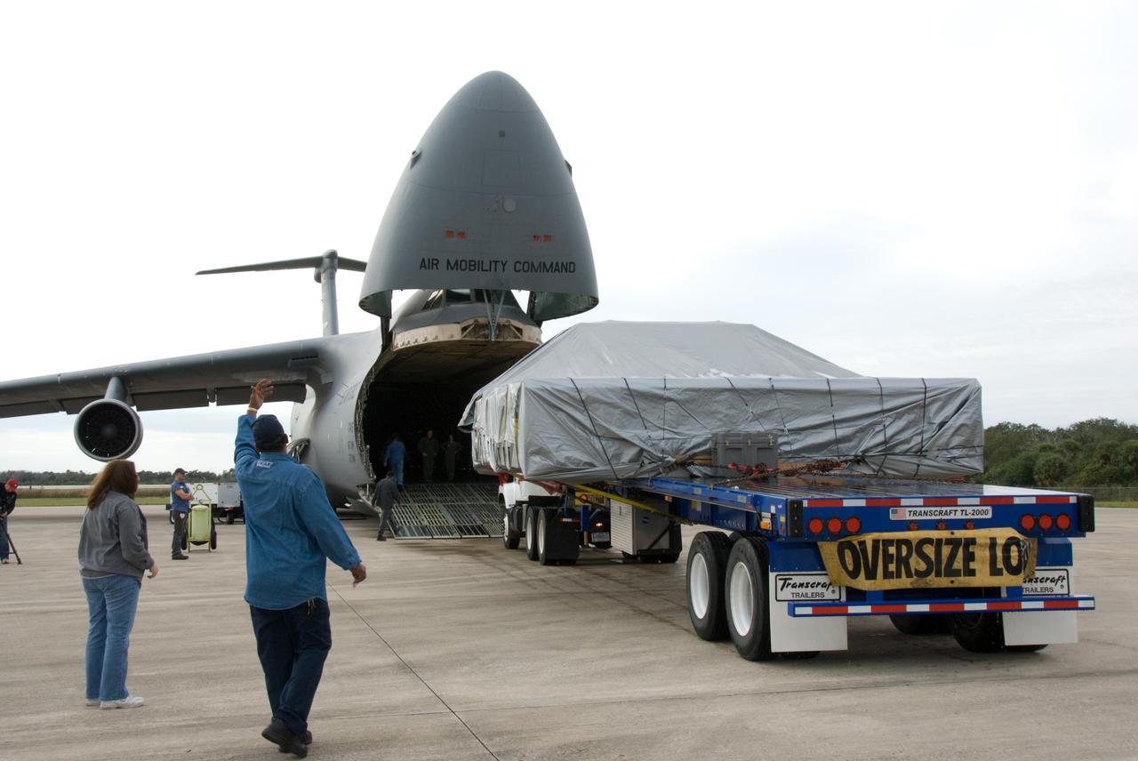CAPE CANAVERAL, Fla. - At the Shuttle Landing Facility at NASA's Kennedy Space Center in Florida, the ExPRESS Logistics Carrier 3, or ELC-3, is removed from the cargo compartment of a U.S. Air Force C-5 aircraft. ELC-3 and the Alpha Magnetic Spectrometer are the primary payloads for space shuttle Endeavour's STS-134 mission to the International Space Station. The STS-134 crew will also deliver spare parts including two S-band communications antennas, a high pressure gas tank, additional spare parts for Dextre and micrometeoroid debris shields. Endeavour's launch is targeted for July 29, 2010. For information on the STS-134 mission objectives and crew, visit http://www.nasa.gov/shuttle. Photo credit: NASA/Kim Shiflett