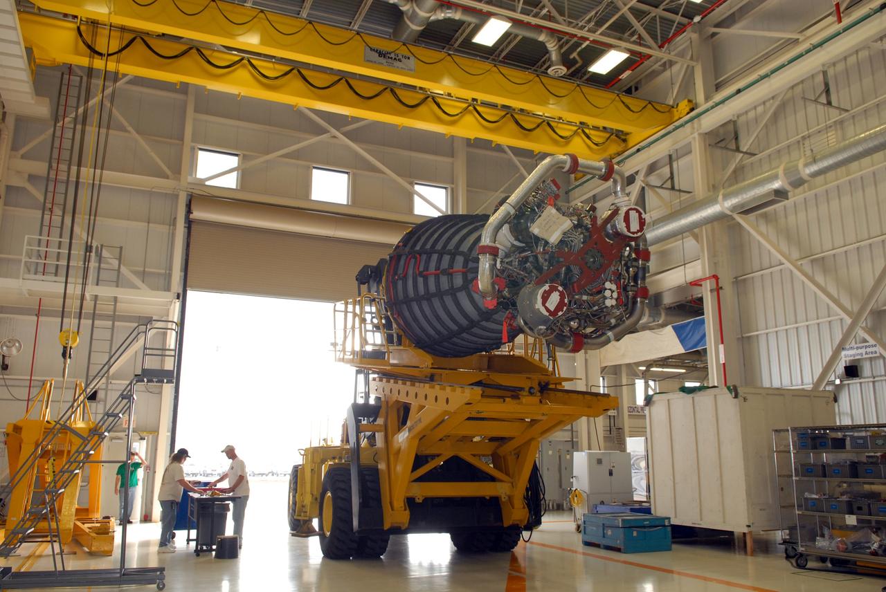 CAPE CANAVERAL, Fla. - In the Space Shuttle Main Engine Processing Facility at NASA's Kennedy Space Center in Florida, a main engine is secured to a transporter and ready for its move to Orbiter Processing Facility Bay 3. There, it will be installed in space shuttle Discovery during processing for the shuttle's STS-131 mission to the International Space Station. The seven-member STS-131 crew will deliver a Multi-Purpose Logistics Module filled with resupply stowage platforms and racks to be transferred to locations around the station. Three spacewalks will include work to attach a spare ammonia tank assembly to the station's exterior and return a European experiment from outside the station's Columbus module. Discovery's launch, targeted for March 18, 2010, will initiate the 33rd shuttle mission to the station. For information on the STS-131 mission and crew, visit http://www.nasa.gov/mission_pages/shuttle/shuttlemissions/sts131/index.html. Photo credit: NASA/Jim Grossmann