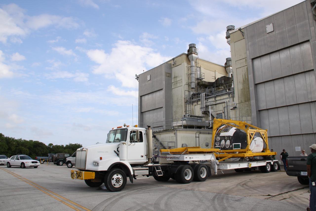 CAPE CANAVERAL, Fla. - At the Hypergolic Maintenance Facility at NASA's Kennedy Space Center in Florida, the Forward Reaction Control System, or FRCS, for space shuttle Discovery is secured on a truck bed and ready for transport to Orbiter Processing Facility Bay 3. Discovery is being prepared for the STS-131 mission, the 33rd flight to the International Space Station. The FRCS provides the thrust for attitude (rotational) maneuvers (pitch, yaw and roll) and for small velocity changes along the orbiter axis (translation maneuvers). The seven-member STS-131 crew will deliver a Multi-Purpose Logistics Module filled with resupply stowage platforms and racks to be transferred to locations around the station. Three spacewalks will include work to attach a spare ammonia tank assembly to the station's exterior and return a European experiment from outside the station's Columbus module. Discovery's launch is targeted for March 18, 2010. For information on the STS-131 mission and crew, visit http://www.nasa.gov/mission_pages/shuttle/shuttlemissions/sts131/index.html. Photo credit: NASA/Troy Cryder