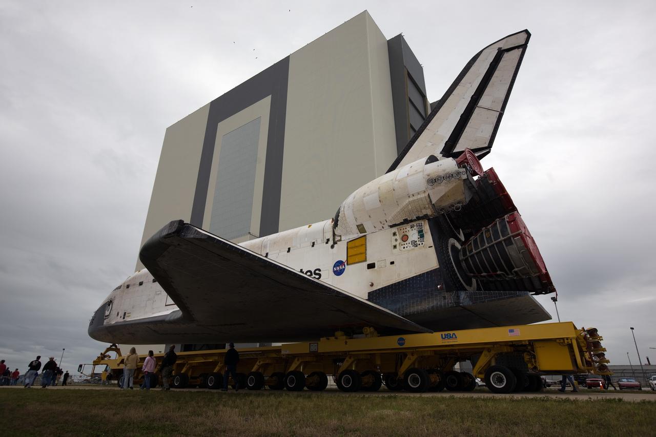 CAPE CANAVERAL, Fla. – At NASA's Kennedy Space Center in Florida, space shuttle Endeavour approaches the Vehicle Assembly Building on its transfer from Orbiter Processing Facility-2. The rollover began at 12:53 a.m. EST and was completed at 2:08 p.m. when Endeavour was towed into the VAB's transfer aisle. Next, Endeavour will be attached to a lifting sling, hoisted over a transom and lowered into High Bay 1, where it will be attached to its external fuel tank and solid rocket boosters. Rollout of the shuttle stack to Kennedy’s Launch Pad 39A, a significant milestone in launch processing activities, is planned for early January 2010. The Italian-built Tranquility module, the primary payload for Endeavour's STS-130 mission, will be installed in the payload bay after the shuttle arrives at the pad. Launch is targeted for early February. For information on the STS-130 mission and crew, visit http://www.nasa.gov/mission_pages/shuttle/shuttlemissions/sts130/index.html. Photo credit: NASA/Dimitri Gerondidakis