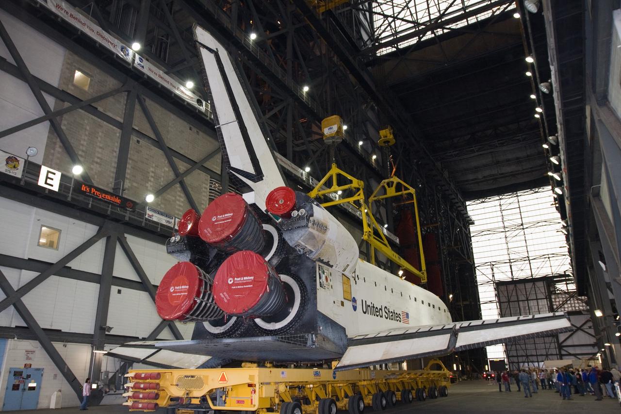 CAPE CANAVERAL, Fla. – At NASA's Kennedy Space Center in Florida, a lifting sling is lowered toward space shuttle Endeavour following its arrival in the Vehicle Assembly Building transfer aisle. The rollover began at 12:53 a.m. EST and was completed at 2:08 p.m. when Endeavour was towed into the VAB's transfer aisle. Next, Endeavour will be attached to the sling, hoisted over a transom and lowered into High Bay 1, where it will be attached to its external fuel tank and solid rocket boosters. Rollout of the shuttle stack to Kennedy’s Launch Pad 39A, a significant milestone in launch processing activities, is planned for early January 2010. The Italian-built Tranquility module, the primary payload for Endeavour's STS-130 mission, will be installed in the payload bay after the shuttle arrives at the pad. Launch is targeted for early February. For information on the STS-130 mission and crew, visit http://www.nasa.gov/mission_pages/shuttle/shuttlemissions/sts130/index.html. Photo credit: NASA/Dimitri Gerondidakis