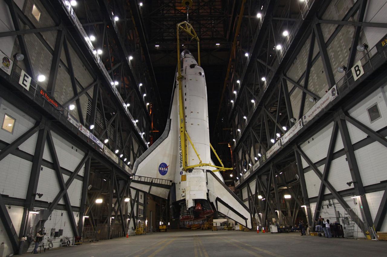 CAPE CANAVERAL, Fla. – In the transfer aisle of the Vehicle Assembly Building at NASA's Kennedy Space Center in Florida, space shuttle Endeavour is rotated into a vertical position with the aid of a lifting sling. Next, Endeavour will be hoisted over a transom and lowered into High Bay 1, where it will be attached to its external fuel tank and solid rocket boosters. Rollout of the shuttle stack to Kennedy’s Launch Pad 39A, a significant milestone in launch processing activities, is planned for early January 2010. The Italian-built Tranquility module, the primary payload for Endeavour's STS-130 mission, will be installed in the payload bay after the shuttle arrives at the pad. Launch is targeted for early February. For information on the STS-130 mission and crew, visit http://www.nasa.gov/mission_pages/shuttle/shuttlemissions/sts130/index.html. Photo credit: NASA/Jack Pfaller