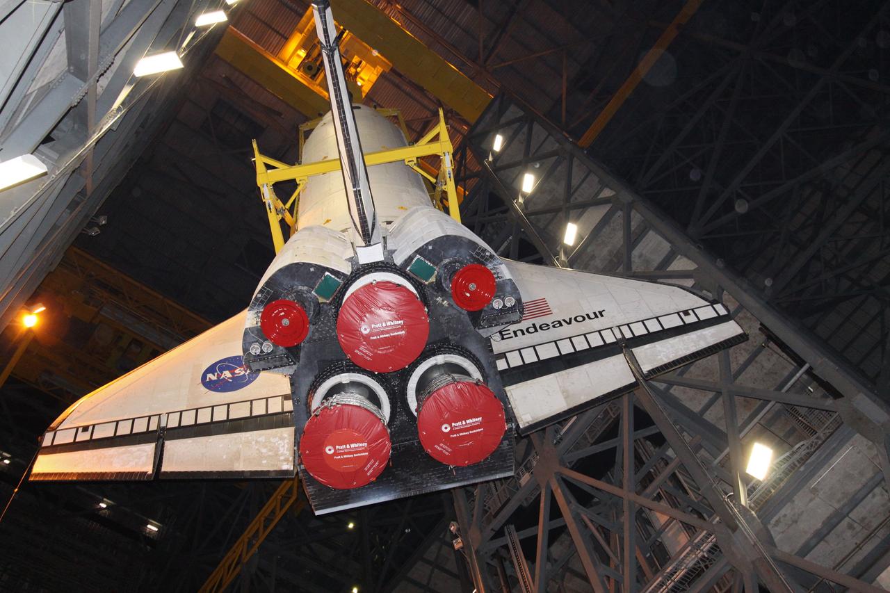 CAPE CANAVERAL, Fla. – In the Vehicle Assembly Building at NASA's Kennedy Space Center in Florida, a crane lifts space shuttle Endeavour over a transom into High Bay 1, where it will be attached to its external fuel tank and solid rocket boosters. Rollout of the shuttle stack to Kennedy’s Launch Pad 39A, a significant milestone in launch processing activities, is planned for early January 2010. The Italian-built Tranquility module, the primary payload for Endeavour's STS-130 mission, will be installed in the payload bay after the shuttle arrives at the pad. Launch is targeted for early February. For information on the STS-130 mission and crew, visit http://www.nasa.gov/mission_pages/shuttle/shuttlemissions/sts130/index.html. Photo credit: NASA/Jack Pfaller