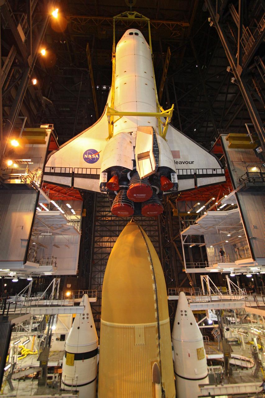 CAPE CANAVERAL, Fla. – In High Bay 1 in the Vehicle Assembly Building at NASA's Kennedy Space Center in Florida, a crane lowers space shuttle Endeavour alongside the external fuel tank and solid rocket boosters to which it will be attached. Rollout of the shuttle stack to Kennedy’s Launch Pad 39A, a significant milestone in launch processing activities, is planned for early January 2010. The Italian-built Tranquility module, the primary payload for Endeavour's STS-130 mission, will be installed in the payload bay after the shuttle arrives at the pad. Launch is targeted for early February. For information on the STS-130 mission and crew, visit http://www.nasa.gov/mission_pages/shuttle/shuttlemissions/sts130/index.html. Photo credit: NASA/Jack Pfaller
