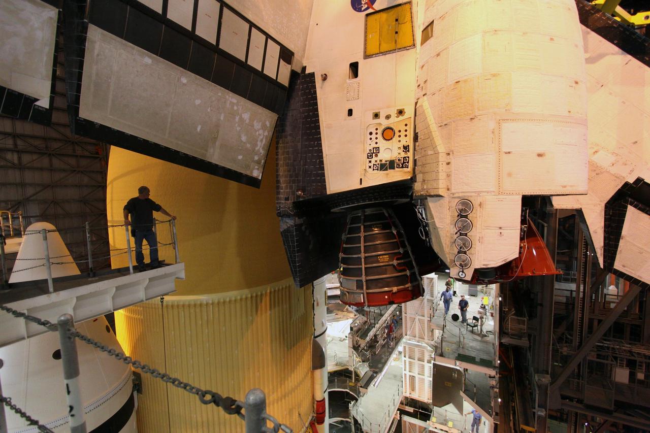 CAPE CANAVERAL, Fla. – In High Bay 1 in the Vehicle Assembly Building at NASA's Kennedy Space Center in Florida, a United Space Alliance technician monitors the progress of space shuttle Endeavour as a crane lowers it alongside the external fuel tank and solid rocket boosters to which it will be attached. Rollout of the shuttle stack to Kennedy’s Launch Pad 39A, a significant milestone in launch processing activities, is planned for early January 2010. The Italian-built Tranquility module, the primary payload for Endeavour's STS-130 mission, will be installed in the payload bay after the shuttle arrives at the pad. Launch is targeted for early February. For information on the STS-130 mission and crew, visit http://www.nasa.gov/mission_pages/shuttle/shuttlemissions/sts130/index.html. Photo credit: NASA/Jack Pfaller