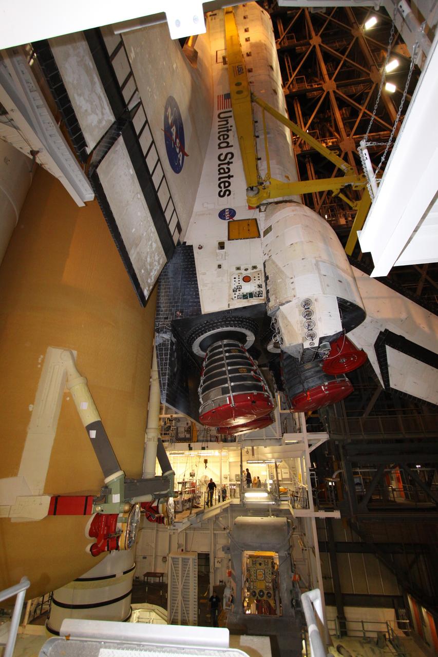 CAPE CANAVERAL, Fla. – In High Bay 1 in the Vehicle Assembly Building at NASA's Kennedy Space Center in Florida, space shuttle Endeavour drops into place alongside the external fuel tank and solid rocket boosters to which it will be attached. Rollout of the shuttle stack to Kennedy’s Launch Pad 39A, a significant milestone in launch processing activities, is planned for early January 2010. The Italian-built Tranquility module, the primary payload for Endeavour's STS-130 mission, will be installed in the payload bay after the shuttle arrives at the pad. Launch is targeted for early February. For information on the STS-130 mission and crew, visit http://www.nasa.gov/mission_pages/shuttle/shuttlemissions/sts130/index.html. Photo credit: NASA/Jack Pfaller