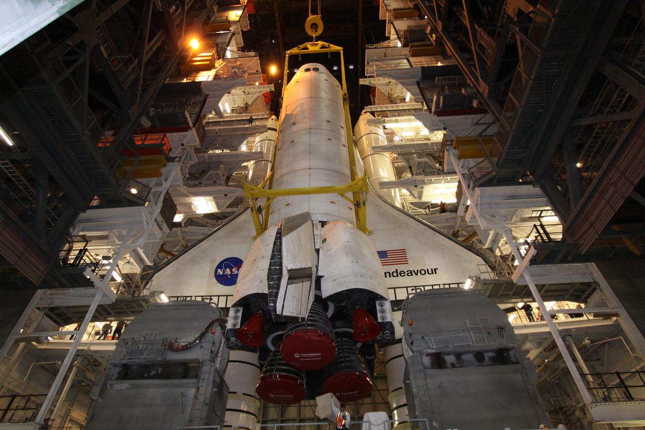 CAPE CANAVERAL, Fla. – In High Bay 1 in the Vehicle Assembly Building at NASA's Kennedy Space Center in Florida, space shuttle Endeavour hovers over the mobile launcher platform to which its external fuel tank and solid rocket boosters are secured. Next, Endeavour will be attached to the tank to complete the shuttle stack. Rollout of the stack to Kennedy’s Launch Pad 39A, a significant milestone in launch processing activities, is planned for early January 2010. The Italian-built Tranquility module, the primary payload for Endeavour's STS-130 mission, will be installed in the payload bay after the shuttle arrives at the pad. Launch is targeted for early February. For information on the STS-130 mission and crew, visit http://www.nasa.gov/mission_pages/shuttle/shuttlemissions/sts130/index.html. Photo credit: NASA/Jack Pfaller