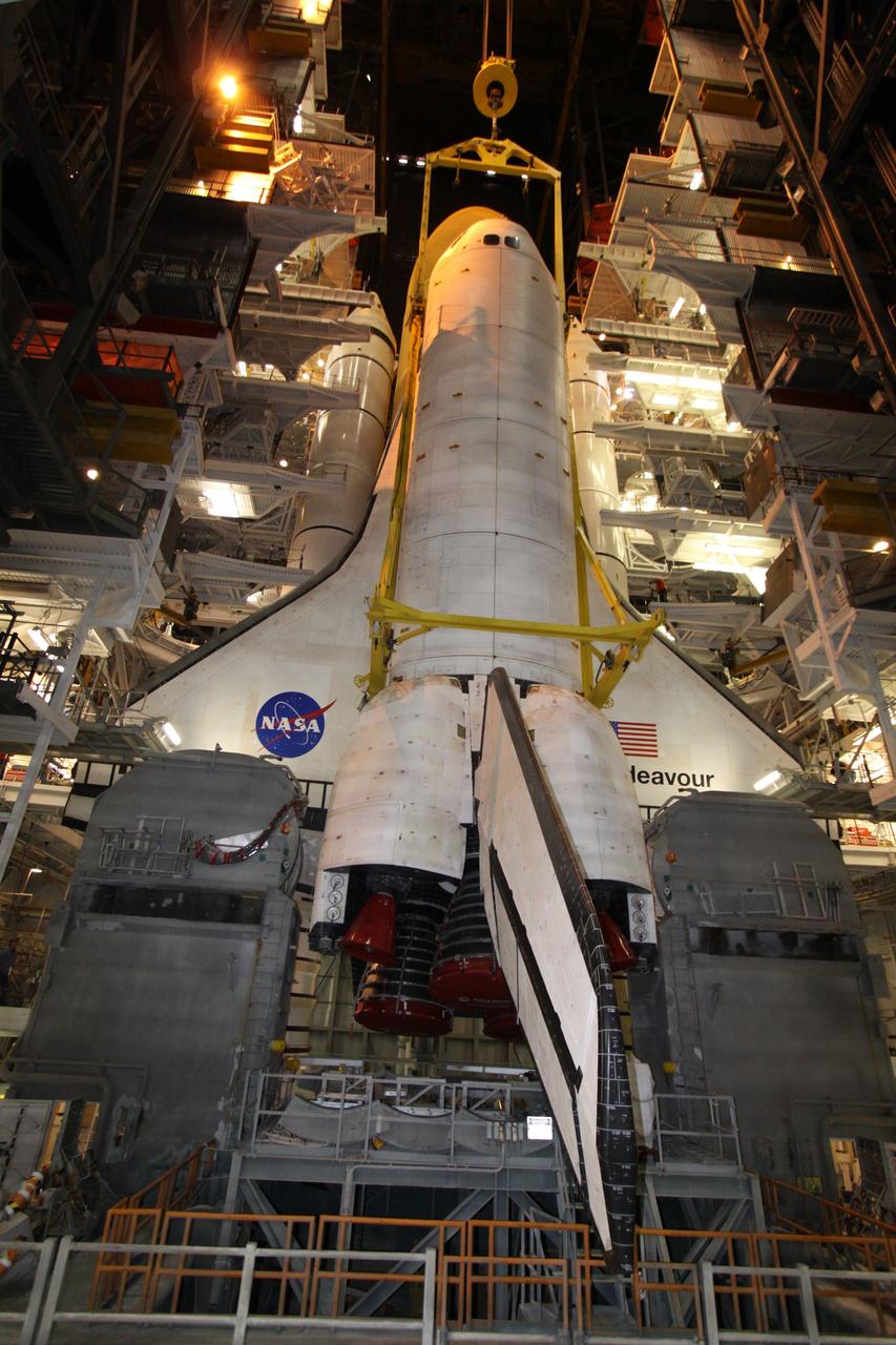 CAPE CANAVERAL, Fla. – In High Bay 1 in the Vehicle Assembly Building at NASA's Kennedy Space Center in Florida, the tail service masts on the mobile launcher platform flank space shuttle Endeavour as preparations are under way to attach it to its external fuel tank and solid rocket boosters. Rollout of the stack to Kennedy’s Launch Pad 39A, a significant milestone in launch processing activities, is planned for early January 2010. The Italian-built Tranquility module, the primary payload for Endeavour's STS-130 mission, will be installed in the payload bay after the shuttle arrives at the pad. Launch is targeted for early February. For information on the STS-130 mission and crew, visit http://www.nasa.gov/mission_pages/shuttle/shuttlemissions/sts130/index.html. Photo credit: NASA/Jack Pfaller