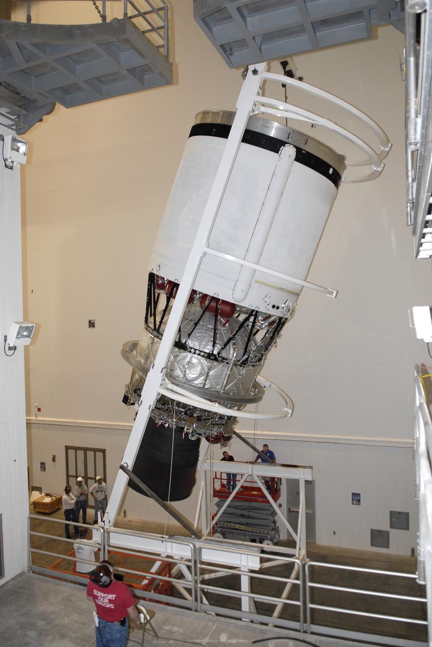 CAPE CANAVERAL, Fla. – In the hangar of the Delta Operations Center at Cape Canaveral Air Force Station in Florida, workers rotate the second stage of a Delta IV rocket into a horizontal position with the aid of a turnover stand following the completion of nozzle extension deployment system testing in the hangar's test cell. The United Launch Alliance Delta IV rocket is slated to launch GOES-P, the latest Geostationary Operational Environmental Satellite developed by NASA for the National Oceanic and Atmospheric Administration, or NOAA. Next, the second stage will be transported to the Horizontal Integration Facility where it will be inspected and prepared for mating with the Delta IV rocket's first stage. GOES-P, a meteorological satellite, is designed to watch for storm development and observed current weather conditions on Earth. Launch of GOES-P is scheduled for no earlier than Feb. 25, 2010, from Launch Complex 37. For information on GOES-P, visit http://goespoes.gsfc.nasa.gov/goes/spacecraft/n_p_spacecraft.html. Photo credit: NASA/Glenn Benson