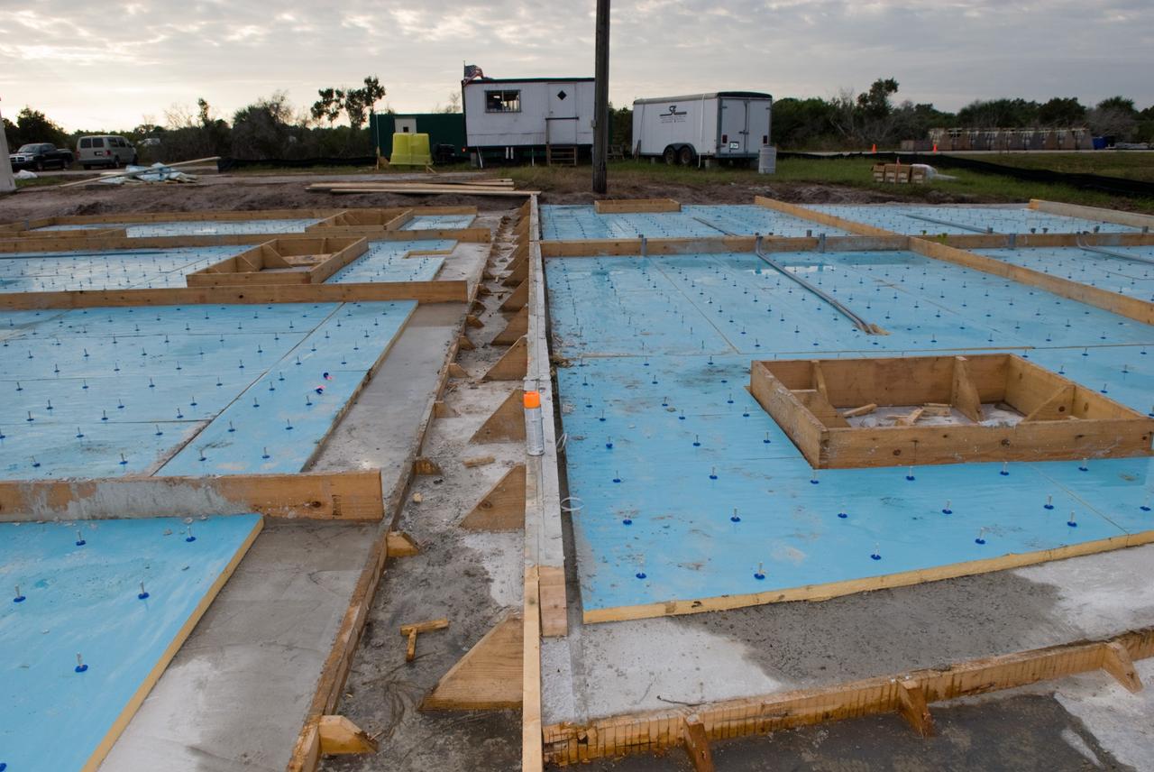 CAPE CANAVERAL, Fla. - Construction of the Propellants North Administrative and Maintenance Facility begins in Launch Complex 39 at NASA's Kennedy Space Center in Florida.    The facility will have a two-story administrative building to house managers, mechanics and technicians who fuel spacecraft at Kennedy adjacent to an 1,800-square-foot single-story shop to store cryogenic fuel transfer equipment.  The new facility will feature high-efficiency roofs and walls, “Cool Dry Quiet” air conditioning with energy recovery technology, efficient lighting, and other sustainable features. The facility is striving to qualify for the U.S. Green Building Council’s Leadership in Energy and Environmental Design, or LEED, Platinum certification. If successful, Propellants North will be the first Kennedy facility to achieve this highest of LEED ratings after it is completed in the summer of 2010.  The facility was designed for NASA by Jones Edmunds and Associates.  Photo credit: NASA/Jim Grossmann