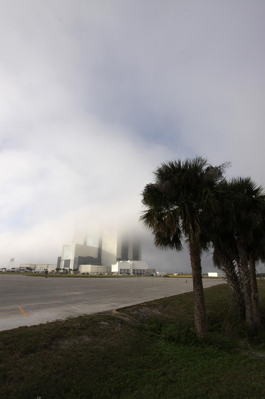 CAPE CANAVERAL, Fla. – At NASA's Kennedy Space Center in Florida, dense fog moving ashore from the Atlantic Ocean engulfs the Vehicle Assembly Building on an atypical December afternoon.  It is the second time in one day that fog has obscured the top of the 525-foot-tall processing facility, known as the VAB.  Space Shuttle Endeavour currently is in the VAB's High Bay 1 where it is being attached to its external fuel tank and solid rocket boosters in preparation for its targeted launch in early February 2010.    Photo credit: NASA/Jack Pfaller
