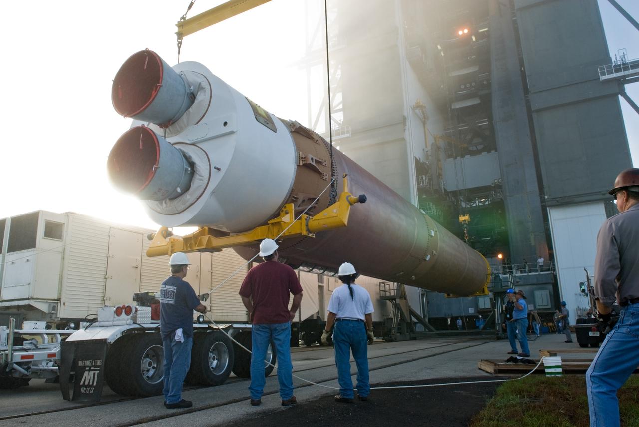 CAPE CANAVERAL, Fla. – Workers lift the Atlas V rocket scheduled to launch NASA's Solar Dynamics Observatory, or SDO, from its transporter at Launch Complex 41 on Cape Canaveral Air Force Station in Florida.    SDO is the first space weather research network mission in NASA's Living With a Star Program. The spacecraft's long-term measurements will give solar scientists in-depth information about changes in the sun's magnetic field and insight into how they affect Earth. Liftoff on the United Launch Alliance Atlas V is scheduled for Feb. 3, 2010. For information on SDO, visit http://www.nasa.gov/sdo.  Photo credit: NASA/Glenn Benson