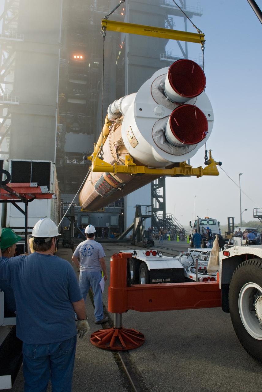 CAPE CANAVERAL, Fla. – Workers lift the Atlas V rocket scheduled to launch NASA's Solar Dynamics Observatory, or SDO, toward the Vertical Integration Facility at Launch Complex 41 on Cape Canaveral Air Force Station in Florida.    SDO is the first space weather research network mission in NASA's Living With a Star Program. The spacecraft's long-term measurements will give solar scientists in-depth information about changes in the sun's magnetic field and insight into how they affect Earth. Liftoff on the United Launch Alliance Atlas V is scheduled for Feb. 3, 2010. For information on SDO, visit http://www.nasa.gov/sdo.  Photo credit: NASA/Glenn Benson