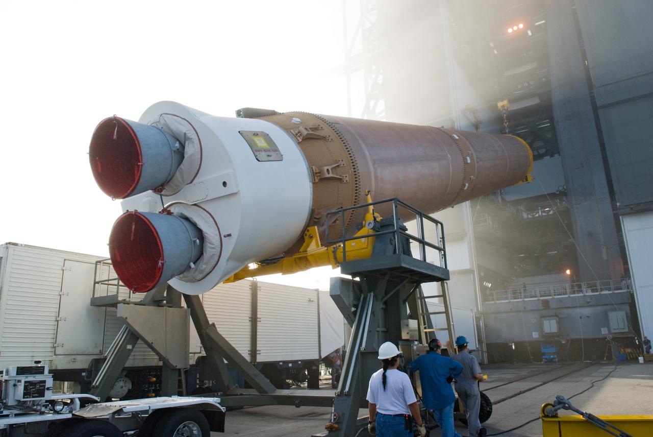 CAPE CANAVERAL, Fla. – Workers lift the Atlas V rocket scheduled to launch NASA's Solar Dynamics Observatory, or SDO, into a vertical position at Launch Complex 41 on Cape Canaveral Air Force Station in Florida.    SDO is the first space weather research network mission in NASA's Living With a Star Program. The spacecraft's long-term measurements will give solar scientists in-depth information about changes in the sun's magnetic field and insight into how they affect Earth. Liftoff on the United Launch Alliance Atlas V is scheduled for Feb. 3, 2010. For information on SDO, visit http://www.nasa.gov/sdo.  Photo credit: NASA/Glenn Benson
