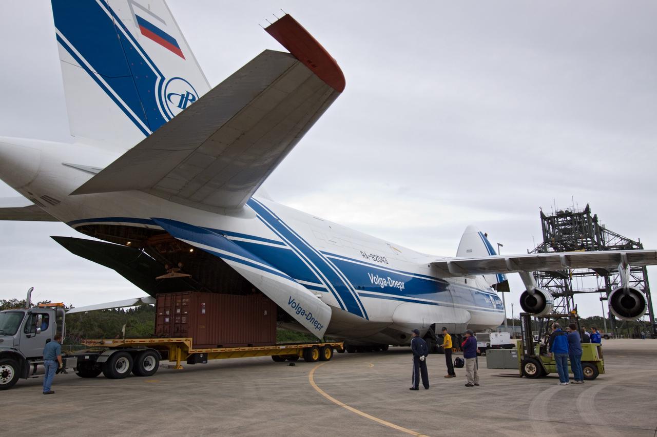 CAPE CANAVERAL, Fla. - At the Shuttle Landing Facility at NASA's Kennedy Space Center in Florida, workers prepare to offload the Russian-built Mini Research Module1, or MRM1, from a Volga-Dnepr Antonov AN-124-100, a Ukranian/Russian aircraft. The second in a series of new pressurized components for Russia, the module, named Rassvet, will be permanently attached to the International Space Station's Zarya module on space shuttle Atlantis' STS-132 mission. An Integrated Cargo Carrier will join the MRM in Atlantis' payload bay. Three spacewalks are planned to store spare components outside the station, including six spare batteries, a boom assembly for the Ku-band antenna and spares for the Canadian Dextre robotic arm extension. A radiator, airlock, and European robotic arm for the Russian Multi-purpose Laboratory Module also will be delivered to the station. Launch is targeted for May 14, 2010. Photo credit: NASA/Jack Pfaller