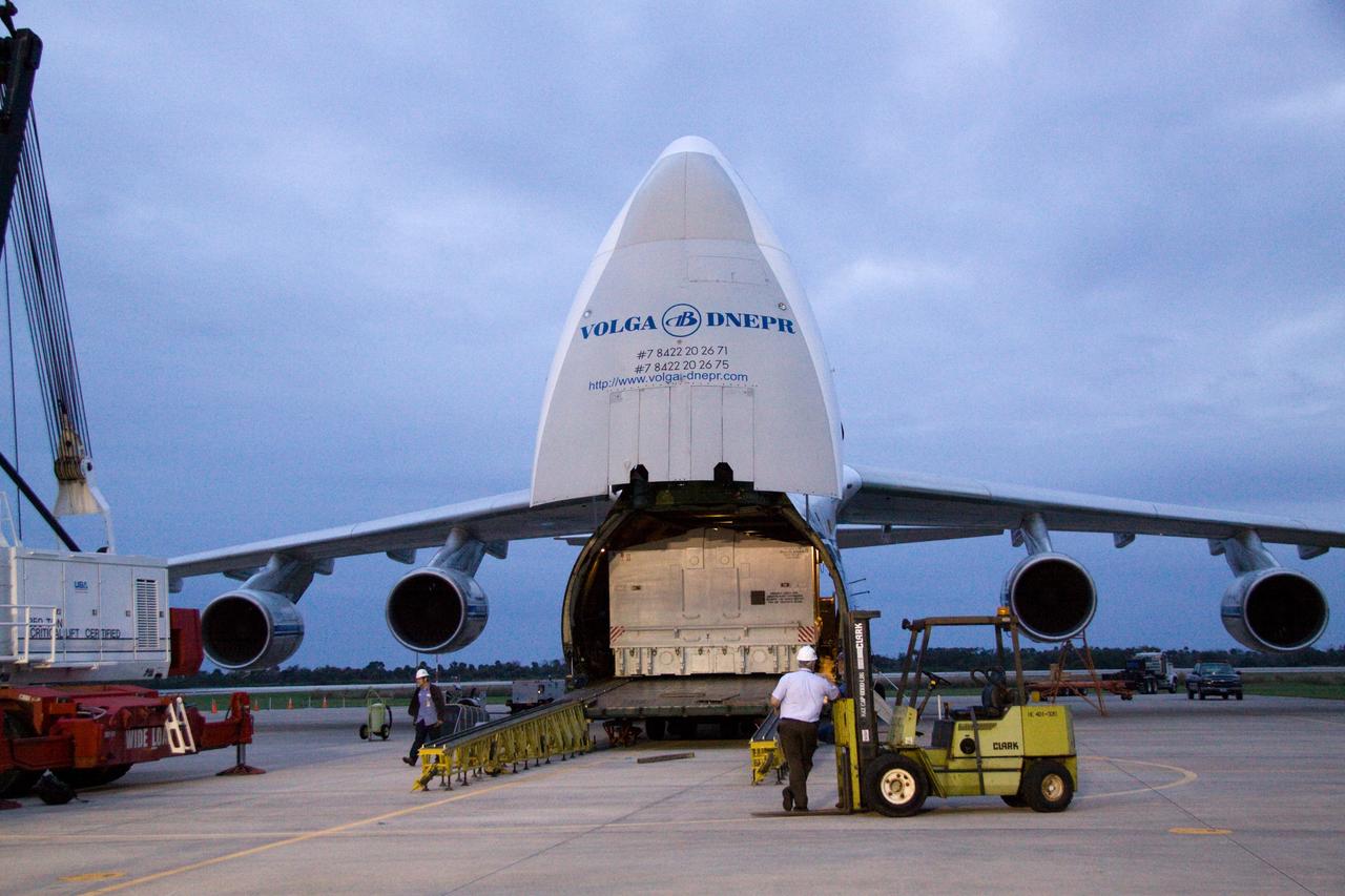 CAPE CANAVERAL, Fla. - At the Shuttle Landing Facility at NASA's Kennedy Space Center in Florida, a transportation case protecting the Russian-built Mini Research Module1, or MRM1, awaits offloading from a Volga-Dnepr Antonov AN-124-100, a Ukranian/Russian aircraft.    The second in a series of new pressurized components for Russia, the module, named Rassvet, will be permanently attached to the International Space Station's Zarya module on space shuttle Atlantis' STS-132 mission. An Integrated Cargo Carrier will join the MRM in Atlantis' payload bay. Three spacewalks are planned to store spare components outside the station, including six spare batteries, a boom assembly for the Ku-band antenna and spares for the Canadian Dextre robotic arm extension. A radiator, airlock, and European robotic arm for the Russian Multi-purpose Laboratory Module also will be delivered to the station.  Launch is targeted for May 14, 2010.  Photo credit: NASA/Jack Pfaller