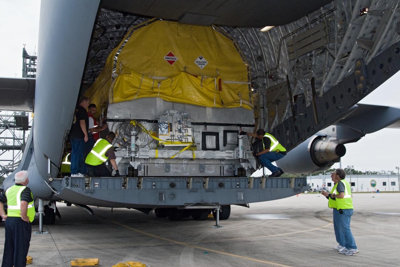 CAPE CANAVERAL, Fla. – At the Shuttle Landing Facility at NASA's Kennedy Space Center in Florida, NASA's GOES-P meteorological satellite is moved to the edge of the cargo bay of a U.S. Air Force C-17 aircraft for offloading. GOES-P, the latest Geostationary Operational Environmental Satellite, was developed by NASA for the National Oceanic and Atmospheric Administration, or NOAA. GOES-P is designed to watch for storm development and observed current weather conditions on Earth. Launch of GOES-P is targeted for no earlier than Feb. 25, 2010, from Launch Complex 37 aboard a United Launch Alliance Delta IV rocket. For information on GOES-P, visit http://goespoes.gsfc.nasa.gov/goes/spacecraft/n_p_spacecraft.html. Photo credit: NASA/Amanda Diller