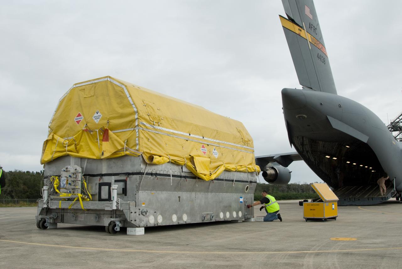 CAPE CANAVERAL, Fla. – At the Shuttle Landing Facility at NASA's Kennedy Space Center in Florida, NASA's GOES-P meteorological satellite has been offloaded from the U.S. Air Force C-17 aircraft on which it was delivered. GOES-P, the latest Geostationary Operational Environmental Satellite, was developed by NASA for the National Oceanic and Atmospheric Administration, or NOAA. GOES-P is designed to watch for storm development and observed current weather conditions on Earth. Launch of GOES-P is targeted for no earlier than Feb. 25, 2010, from Launch Complex 37 aboard a United Launch Alliance Delta IV rocket. For information on GOES-P, visit http://goespoes.gsfc.nasa.gov/goes/spacecraft/n_p_spacecraft.html. Photo credit: NASA/Amanda Diller