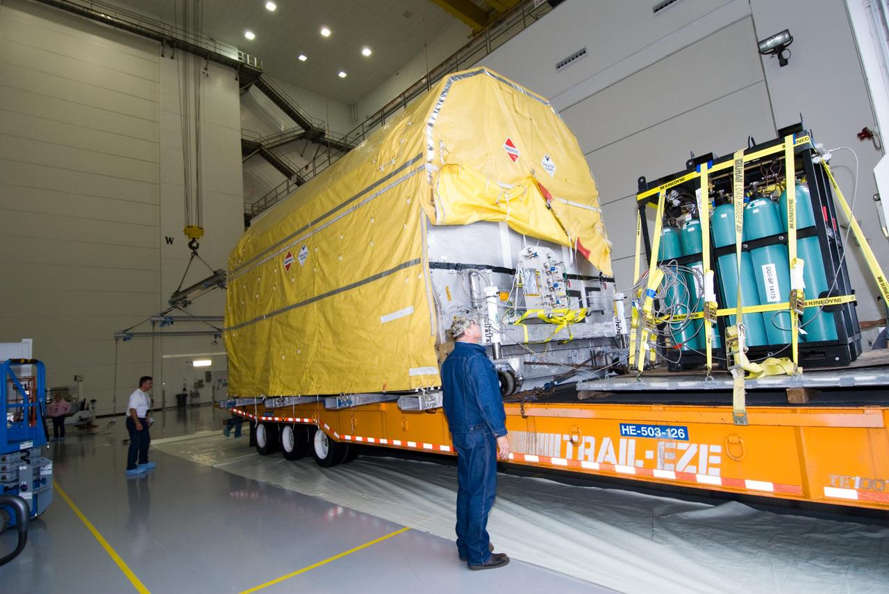 CAPE CANAVERAL, Fla. – At the Astrotech Space Operations facility in Titusville, Fla., preparations are under way to remove NASA's GOES-P meteorological satellite from the transporter which delivered it from NASA Kennedy Space Center's Shuttle Landing Facility. GOES-P, the latest Geostationary Operational Environmental Satellite, was developed by NASA for the National Oceanic and Atmospheric Administration, or NOAA. GOES-P is designed to watch for storm development and observed current weather conditions on Earth. Launch of GOES-P is targeted for no earlier than Feb. 25, 2010, from Launch Complex 37 aboard a United Launch Alliance Delta IV rocket. For information on GOES-P, visit http://goespoes.gsfc.nasa.gov/goes/spacecraft/n_p_spacecraft.html. Photo credit: NASA/Amanda Diller