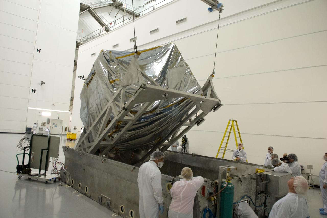 CAPE CANAVERAL, Fla. – At the Astrotech Space Operations facility in Titusville, Fla., NASA's newly arrived GOES-P meteorological satellite is lifted from its transportation case.    GOES-P, the latest Geostationary Operational Environmental Satellite, was developed by NASA for the National Oceanic and Atmospheric Administration, or NOAA.  GOES-P is designed to watch for storm development and observed current weather conditions on Earth.  Launch of GOES-P is targeted for no earlier than Feb. 25, 2010, from Launch Complex 37 aboard a United Launch Alliance Delta IV rocket.  For information on GOES-P, visit http://goespoes.gsfc.nasa.gov/goes/spacecraft/n_p_spacecraft.html. Photo credit: NASA/Glenn Benson