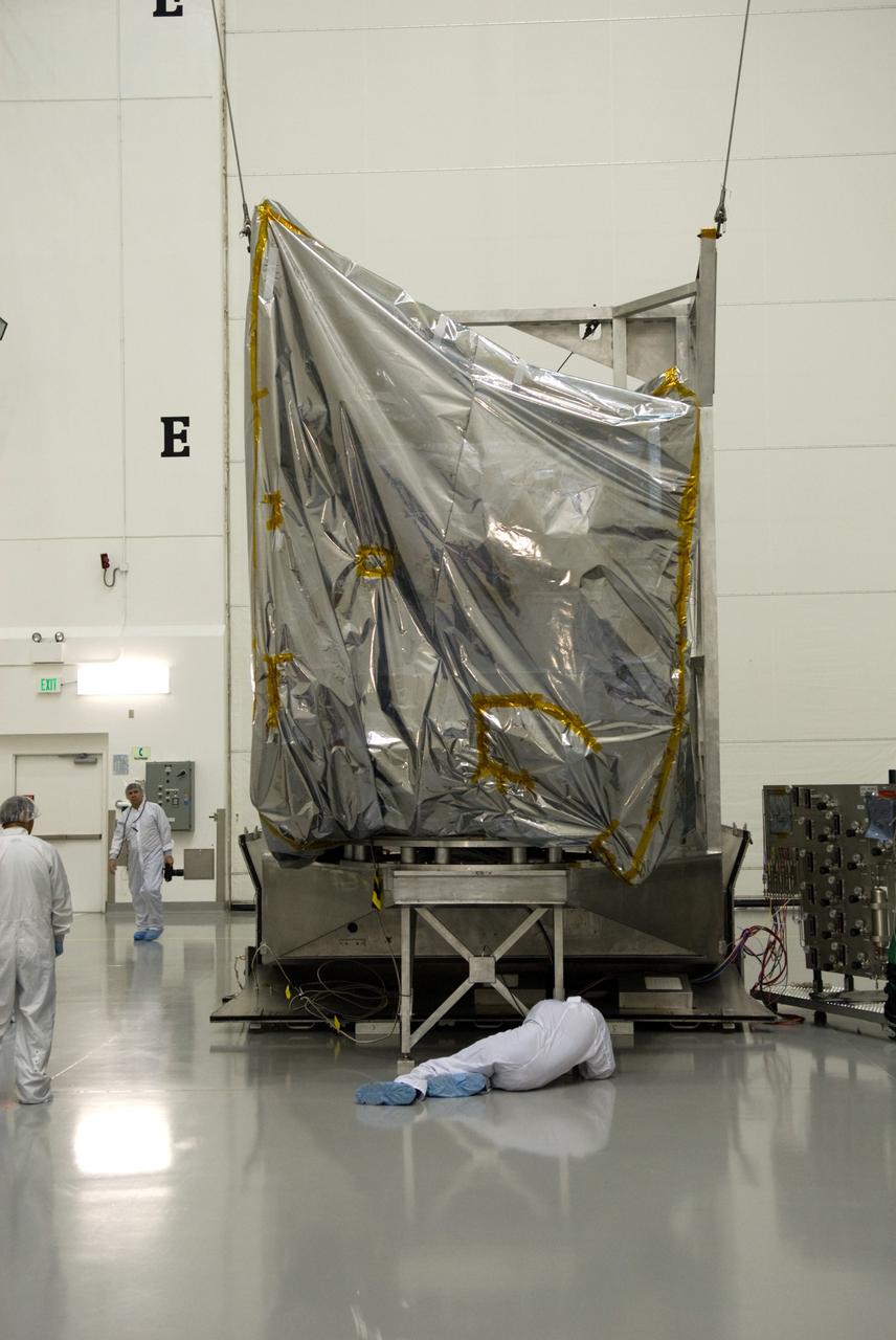 CAPE CANAVERAL, Fla. – At the Astrotech Space Operations facility in Titusville, Fla., NASA's newly arrived GOES-P meteorological satellite has been lifted into a vertical position and is ready for further processing for launch. GOES-P, the latest Geostationary Operational Environmental Satellite, was developed by NASA for the National Oceanic and Atmospheric Administration, or NOAA. GOES-P is designed to watch for storm development and observed current weather conditions on Earth. Launch of GOES-P is targeted for no earlier than Feb. 25, 2010, from Launch Complex 37 aboard a United Launch Alliance Delta IV rocket. For information on GOES-P, visit http://goespoes.gsfc.nasa.gov/goes/spacecraft/n_p_spacecraft.html. Photo credit: NASA/Glenn Benson