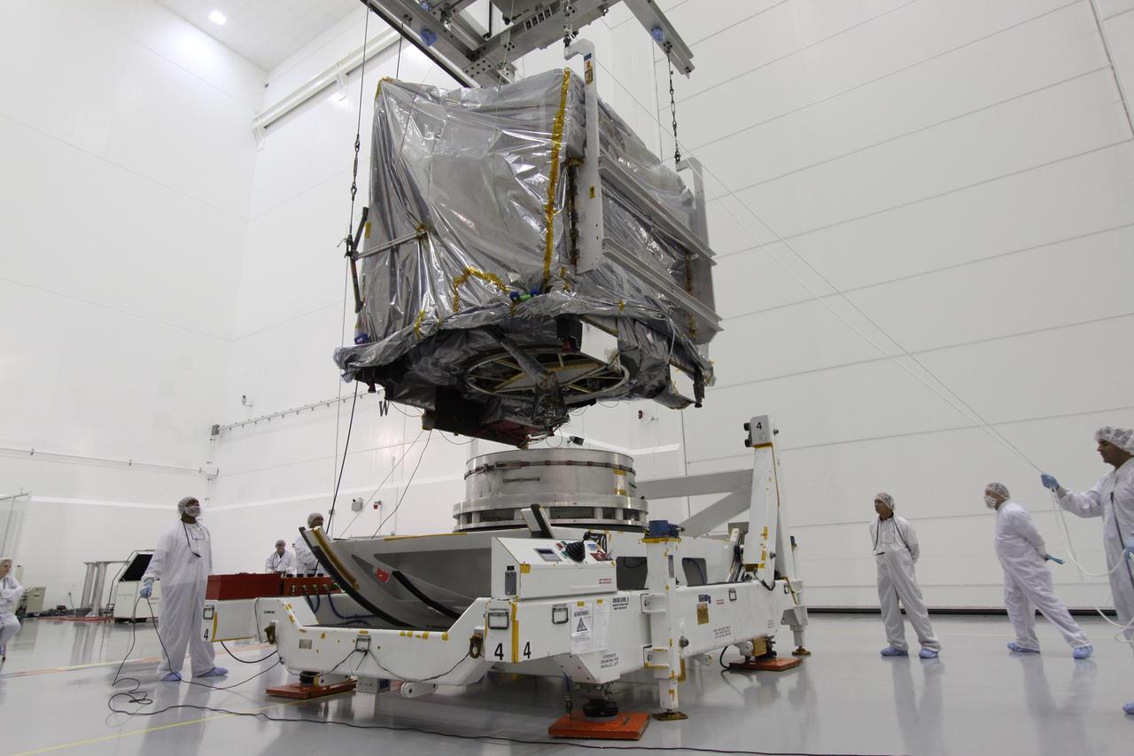 CAPE CANAVERAL, Fla. – At the Astrotech Space Operations facility in Titusville, Fla., NASA's GOES-P meteorological satellite, covered in a protective bag, is positioned over a Ransome table on which it will be secured and rotated for further testing. GOES-P, the latest Geostationary Operational Environmental Satellite, was developed by NASA for the National Oceanic and Atmospheric Administration, or NOAA. GOES-P is designed to watch for storm development and observed current weather conditions on Earth. Launch of GOES-P is targeted for no earlier than Feb. 25, 2010, from Launch Complex 37 aboard a United Launch Alliance Delta IV rocket. For information on GOES-P, visit http://goespoes.gsfc.nasa.gov/goes/spacecraft/n_p_spacecraft.html. Photo credit: NASA/Jack Pfaller