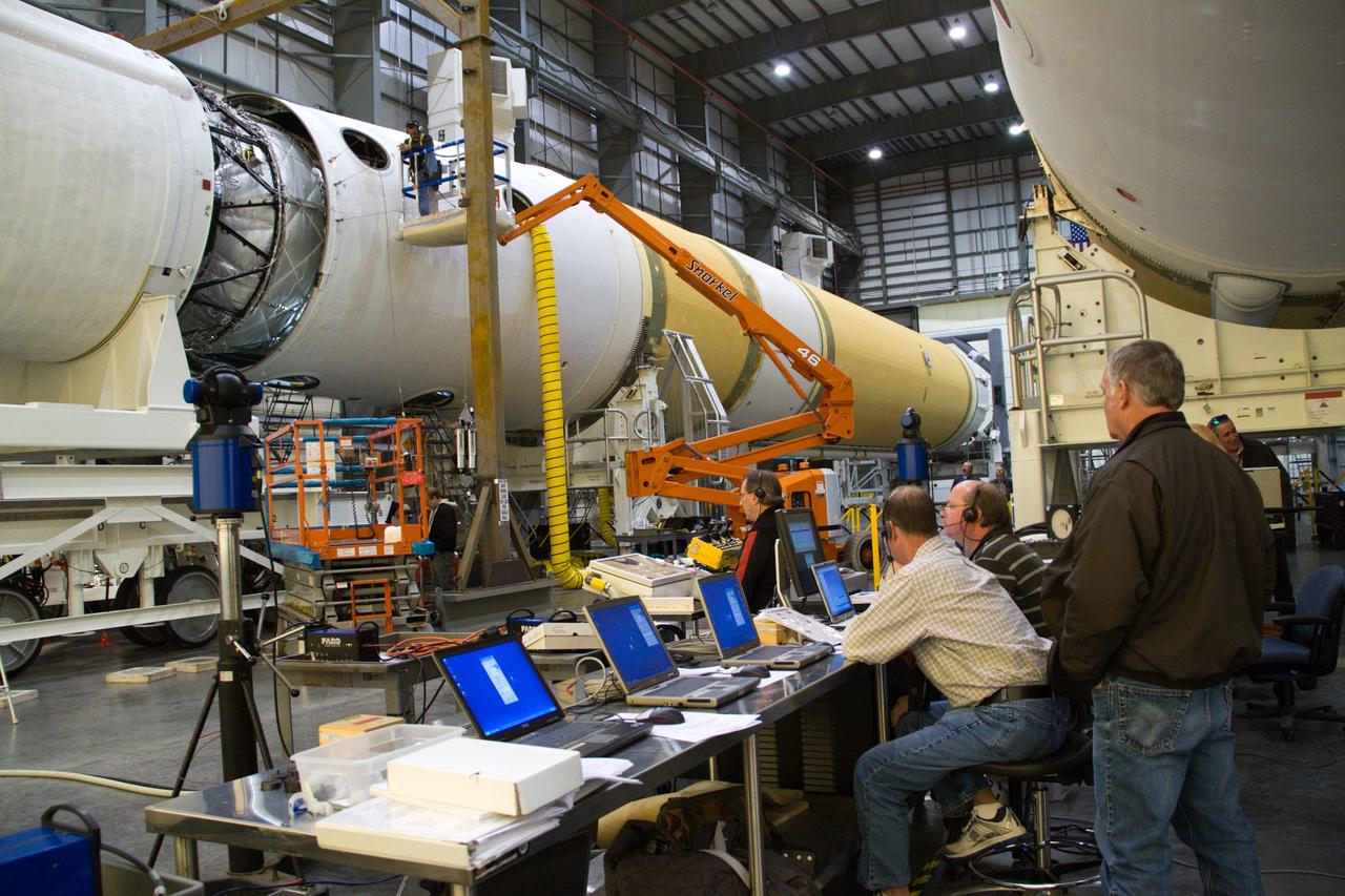 CAPE CANAVERAL, Fla. – In the Horizontal Integration Facility at Launch Complex 37 on Cape Canaveral Air Force Station in Florida, a team of rocket specialists monitors the progress of the operation to mate the second stage of a Delta IV rocket to the first stage.    This United Launch Alliance Delta IV rocket is slated to launch GOES-P, the latest Geostationary Operational Environmental Satellite developed by NASA for the National Oceanic and Atmospheric Administration, or NOAA. Launch is targeted for Feb. 25.  For information on GOES-P, visit http://goespoes.gsfc.nasa.gov/goes/spacecraft/n_p_spacecraft.html. Photo credit: NASA/Jack Pfaller