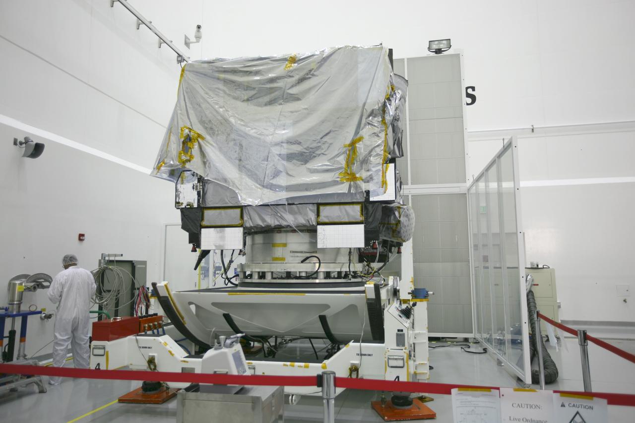 CAPE CANAVERAL, Fla. – At the Astrotech Space Operations facility in Titusville, Fla., preparations are under way to remove the protective wrapping from the NASA's GOES-P meteorological satellite, secured on a Ransome table.    GOES-P, the latest Geostationary Operational Environmental Satellite, was developed by NASA for the National Oceanic and Atmospheric Administration, or NOAA.  GOES-P is designed to watch for storm development and observed current weather conditions on Earth.  Launch of GOES-P is targeted for no earlier than March 1 from Launch Complex 37 aboard a United Launch Alliance Delta IV rocket.  For information on GOES-P, visit http://goespoes.gsfc.nasa.gov/goes/spacecraft/n_p_spacecraft.html. Photo credit: NASA/Amanda Diller
