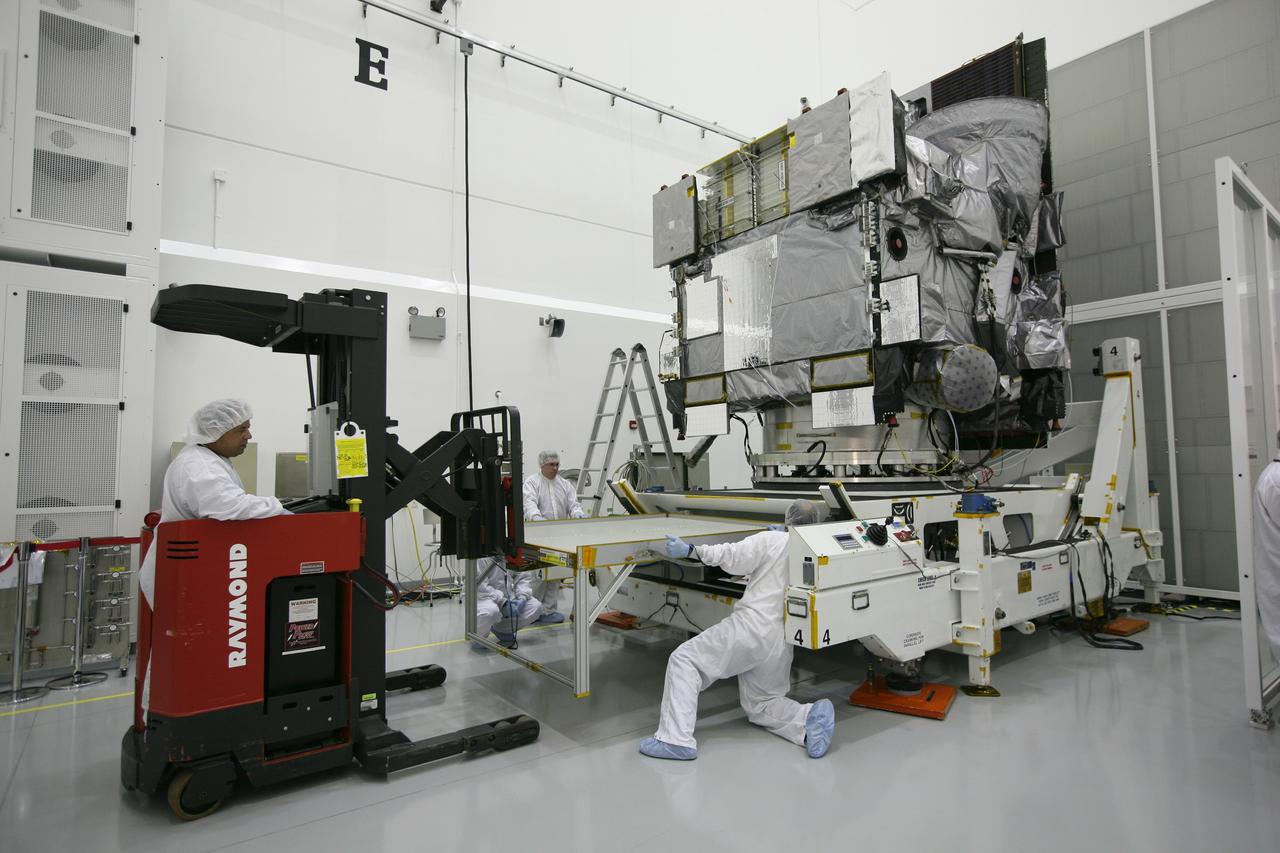 CAPE CANAVERAL, Fla. – At the Astrotech Space Operations facility in Titusville, Fla., spacecraft technicians prepare to rotate NASA's GOES-P meteorological satellite.    GOES-P, the latest Geostationary Operational Environmental Satellite, was developed by NASA for the National Oceanic and Atmospheric Administration, or NOAA.  GOES-P is designed to watch for storm development and observed current weather conditions on Earth.  Launch of GOES-P is targeted for no earlier than March 1 from Launch Complex 37 aboard a United Launch Alliance Delta IV rocket.  For information on GOES-P, visit http://goespoes.gsfc.nasa.gov/goes/spacecraft/n_p_spacecraft.html. Photo credit: NASA/Amanda Diller