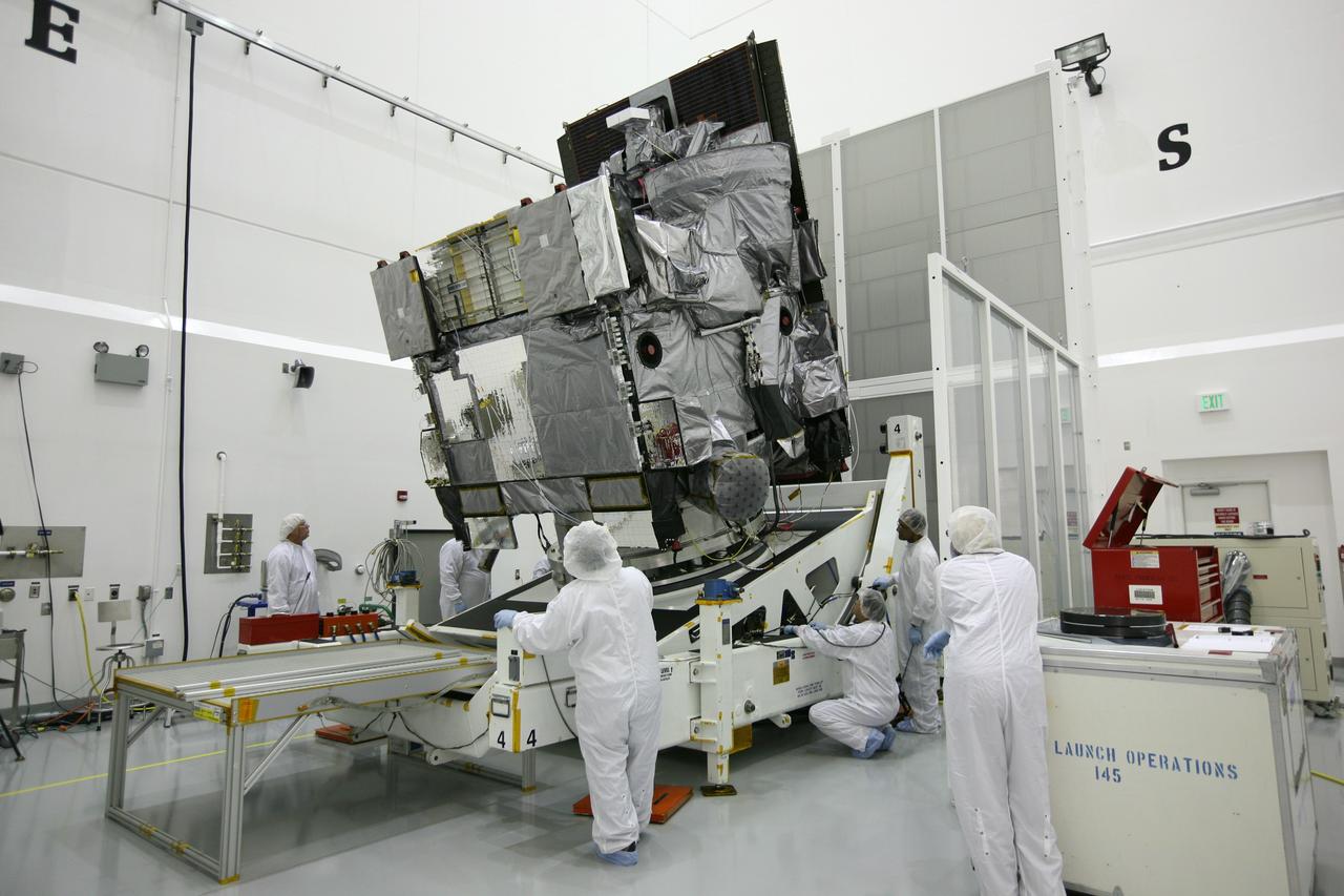 CAPE CANAVERAL, Fla. – At the Astrotech Space Operations facility in Titusville, Fla., spacecraft technicians rotate NASA's GOES-P meteorological satellite. GOES-P, the latest Geostationary Operational Environmental Satellite, was developed by NASA for the National Oceanic and Atmospheric Administration, or NOAA. GOES-P is designed to watch for storm development and observed current weather conditions on Earth. Launch of GOES-P is targeted for no earlier than March 1 from Launch Complex 37 aboard a United Launch Alliance Delta IV rocket. For information on GOES-P, visit http://goespoes.gsfc.nasa.gov/goes/spacecraft/n_p_spacecraft.html. Photo credit: NASA/Amanda Diller