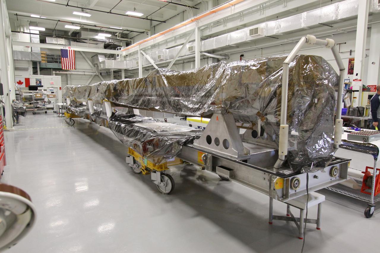 CAPE CANAVERAL, Fla. - In the Remote Manipulator System Lab inside the Vehicle Assembly Building at NASA's Kennedy Space Center in Florida, space shuttle Atlantis' orbiter boom sensor system, or OBSS, is prepared for maintenance.    The 50-foot-long OBSS attaches to the end of the shuttle’s robotic arm and supports the cameras and laser systems used to inspect the shuttle’s thermal protection system while in space.  Atlantis is next slated to deliver an Integrated Cargo Carrier and Russian-built Mini Research Module to the International Space Station on the STS-132 mission. The second in a series of new pressurized components for Russia, the module will be permanently attached to the Zarya module. Three spacewalks are planned to store spare components outside the station, including six spare batteries, a boom assembly for the Ku-band antenna and spares for the Canadian Dextre robotic arm extension. A radiator, airlock and European robotic arm for the Russian Multi-purpose Laboratory Module also are payloads on the flight.  Launch is targeted for May 14, 2010.  Photo credit: NASA/Jack Pfaller