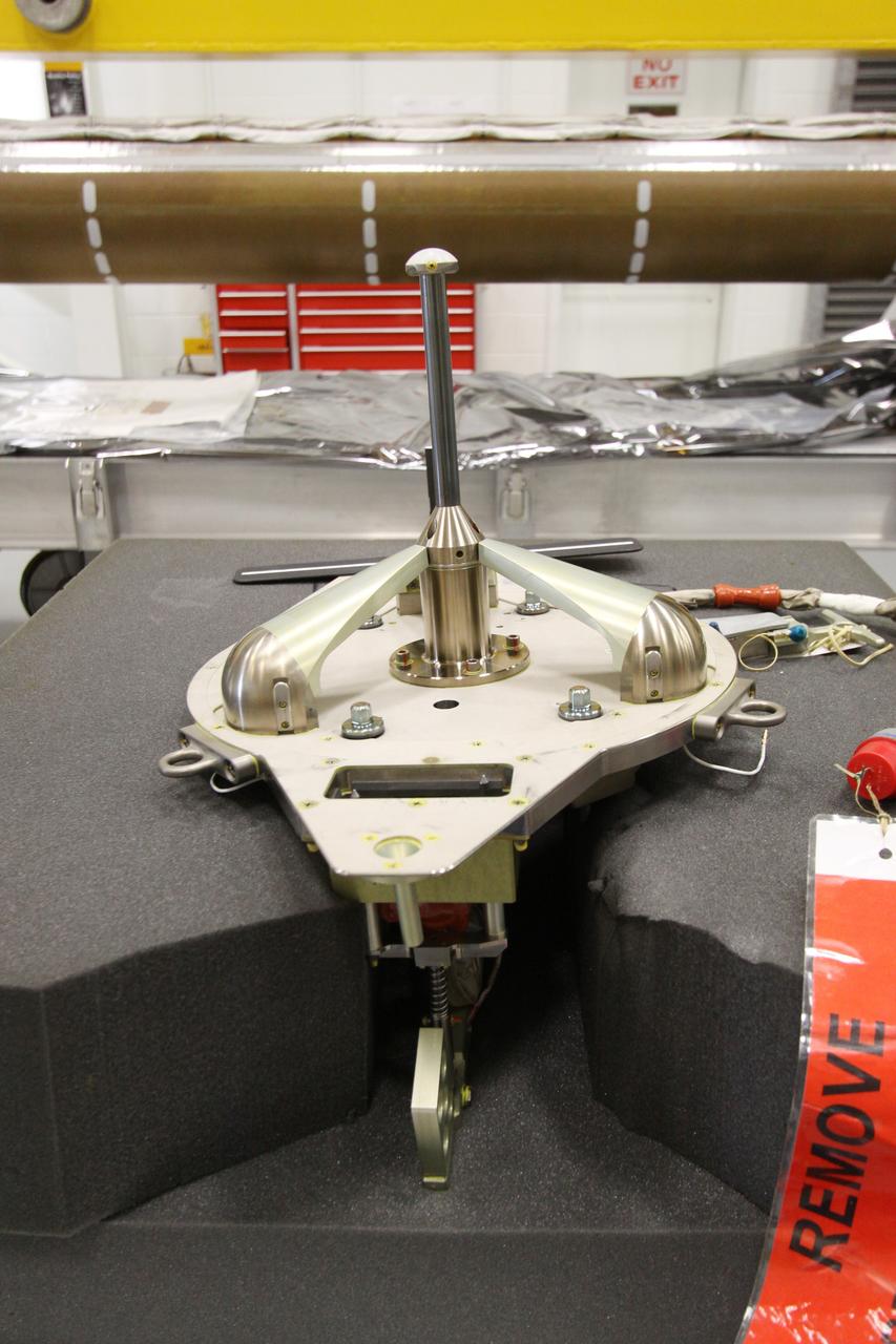 CAPE CANAVERAL, Fla. - In the Remote Manipulator System Lab inside the Vehicle Assembly Building at NASA's Kennedy Space Center in Florida, this close-up shows the electrical flight grapple fixture which will be installed in the forward transition and X-guide restraint of the inspection boom assembly, or IBA, on space shuttle Atlantis' orbiter boom sensor system, or OBSS.  The IBA is removed from the shuttle every other processing flow for a detailed inspection. After five consecutive flights, all IBA internal components are submitted to a thorough electrical checkout in the lab.    The 50-foot-long OBSS attaches to the end of the shuttle’s robotic arm and supports the cameras and laser systems used to inspect the shuttle’s thermal protection system while in space.  Atlantis is next slated to deliver an Integrated Cargo Carrier and Russian-built Mini Research Module to the International Space Station on the STS-132 mission. The second in a series of new pressurized components for Russia, the module will be permanently attached to the Zarya module. Three spacewalks are planned to store spare components outside the station, including six spare batteries, a boom assembly for the Ku-band antenna and spares for the Canadian Dextre robotic arm extension. A radiator, airlock and European robotic arm for the Russian Multi-purpose Laboratory Module also are payloads on the flight.  Launch is targeted for May 14, 2010.  Photo credit: NASA/Jack Pfaller