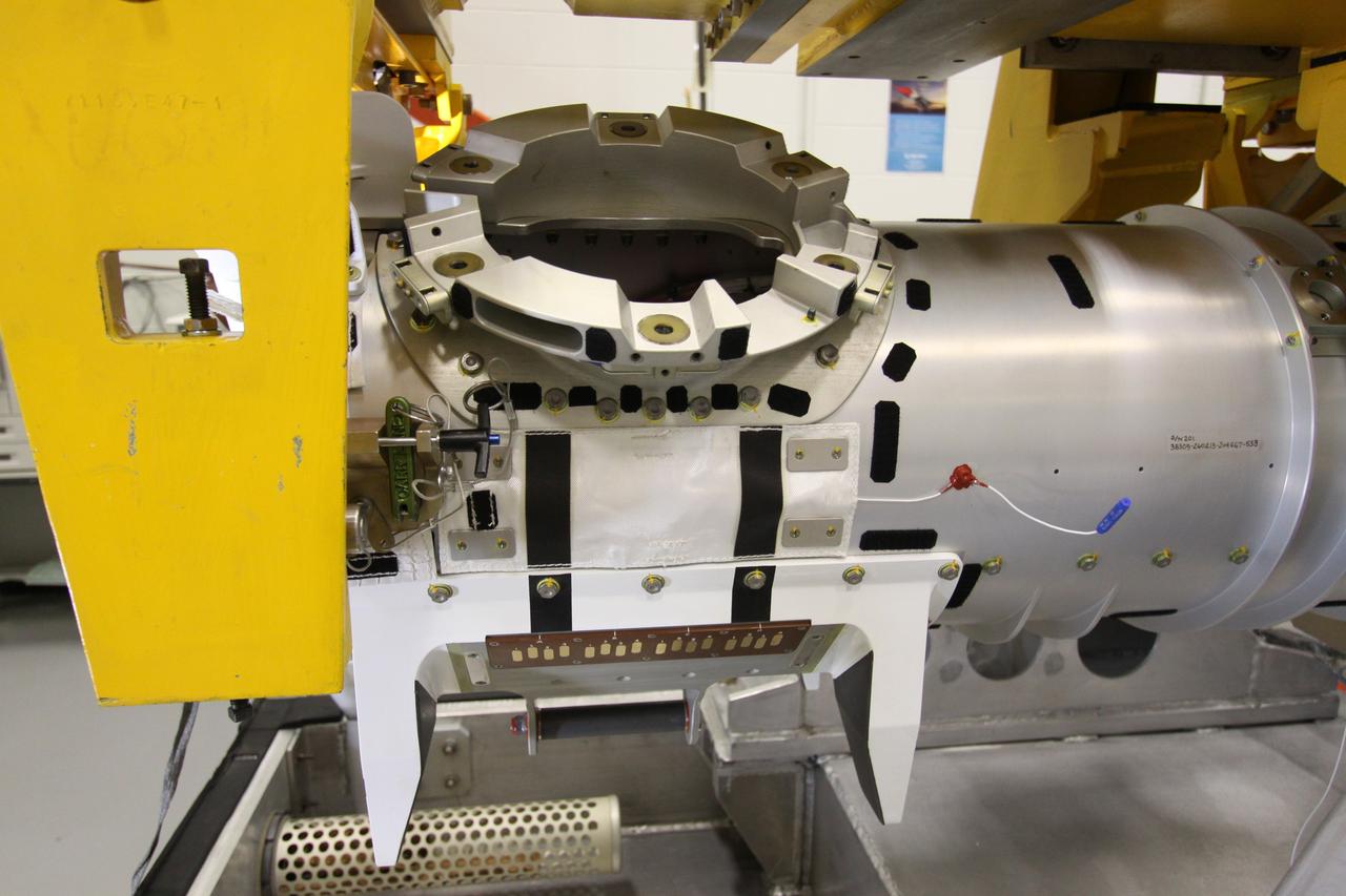 CAPE CANAVERAL, Fla. - In the Remote Manipulator System Lab inside the Vehicle Assembly Building at NASA's Kennedy Space Center in Florida, this close-up shows the forward transition and X-guide restraint of the inspection boom assembly, or IBA, on space shuttle Atlantis' orbiter boom sensor system, or OBSS.  The IBA is removed from the shuttle every other processing flow for a detailed inspection. After five consecutive flights, all IBA internal components are submitted to a thorough electrical checkout in the lab.    The 50-foot-long OBSS attaches to the end of the shuttle’s robotic arm and supports the cameras and laser systems used to inspect the shuttle’s thermal protection system while in space.  Atlantis is next slated to deliver an Integrated Cargo Carrier and Russian-built Mini Research Module to the International Space Station on the STS-132 mission. The second in a series of new pressurized components for Russia, the module will be permanently attached to the Zarya module. Three spacewalks are planned to store spare components outside the station, including six spare batteries, a boom assembly for the Ku-band antenna and spares for the Canadian Dextre robotic arm extension. A radiator, airlock and European robotic arm for the Russian Multi-purpose Laboratory Module also are payloads on the flight.  Launch is targeted for May 14, 2010.  Photo credit: NASA/Jack Pfaller