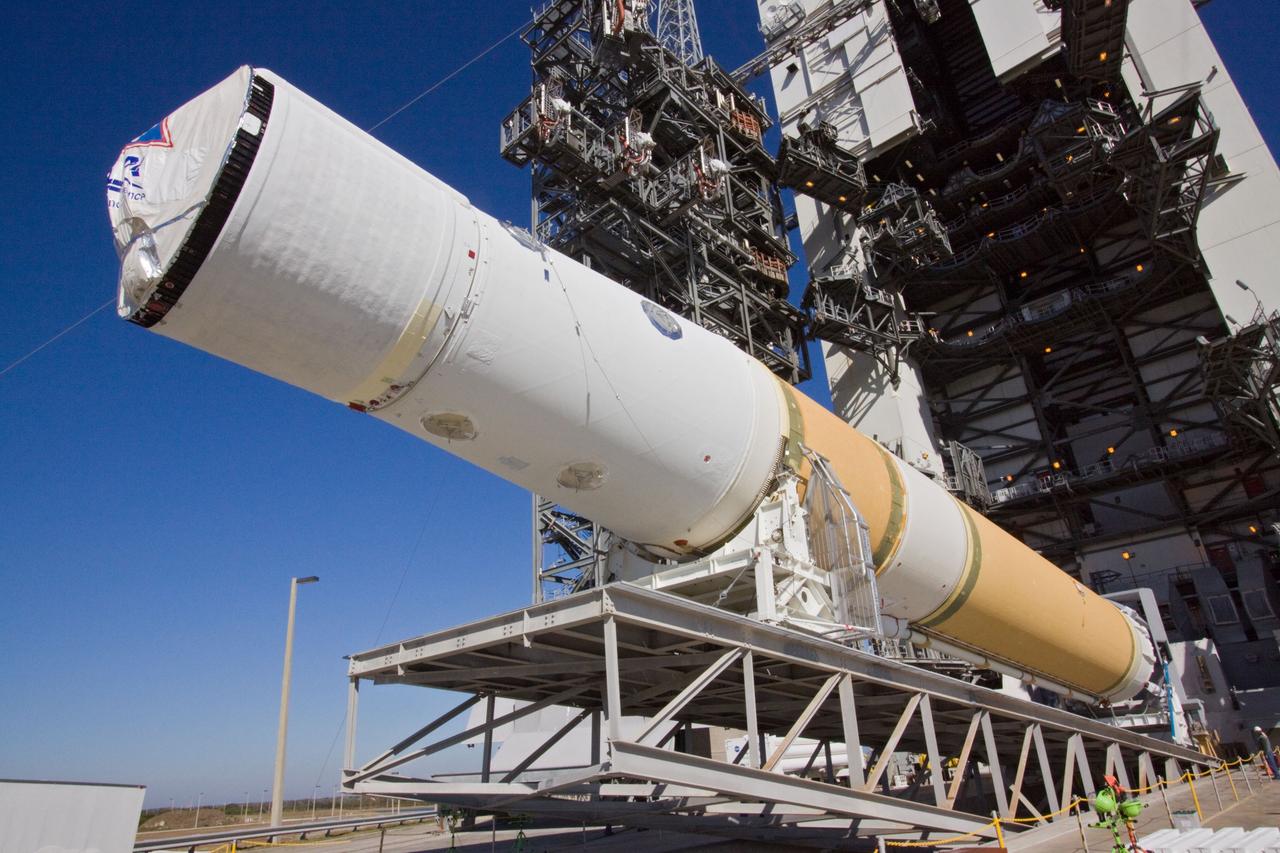 CAPE CANAVERAL, Fla. – At Launch Complex 37 on Cape Canaveral Air Force Station in Florida, the lift of the core stage of a Delta IV rocket into the mobile service tower begins.    The rocket's first stage mated to its second stage comprise the core stage. The rocket is slated to launch GOES-P, the latest Geostationary Operational Environmental Satellite developed by NASA for the National Oceanic and Atmospheric Administration, or NOAA. The Delta IV rocket will be launched by United Launch Alliance for Boeing Launch Services under an FAA commercial license.  Launch is targeted for no earlier than March 1.  For information on GOES-P, visit http://goespoes.gsfc.nasa.gov/goes/spacecraft/n_p_spacecraft.html. Photo credit: NASA/Jack Pfaller