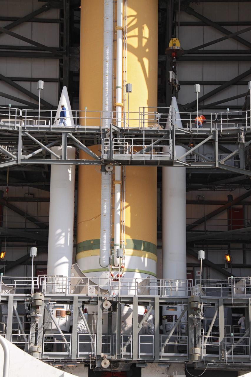 CAPE CANAVERAL, Fla. – In the mobile service tower at Launch Complex 37 on Cape Canaveral Air Force Station in Florida, the Delta IV rocket slated to launch NASA's GOES-P meteorological satellite now has two solid rocket boosters attached to the base of the rocket.    GOES-P is the latest Geostationary Operational Environmental Satellite developed by NASA for the National Oceanic and Atmospheric Administration, or NOAA. The Delta IV rocket will be launched by United Launch Alliance for Boeing Launch Services under an FAA commercial license.  Launch is targeted for no earlier than March 1.  For information on GOES-P, visit http://goespoes.gsfc.nasa.gov/goes/spacecraft/n_p_spacecraft.html. Photo credit: NASA/Jack Pfaller