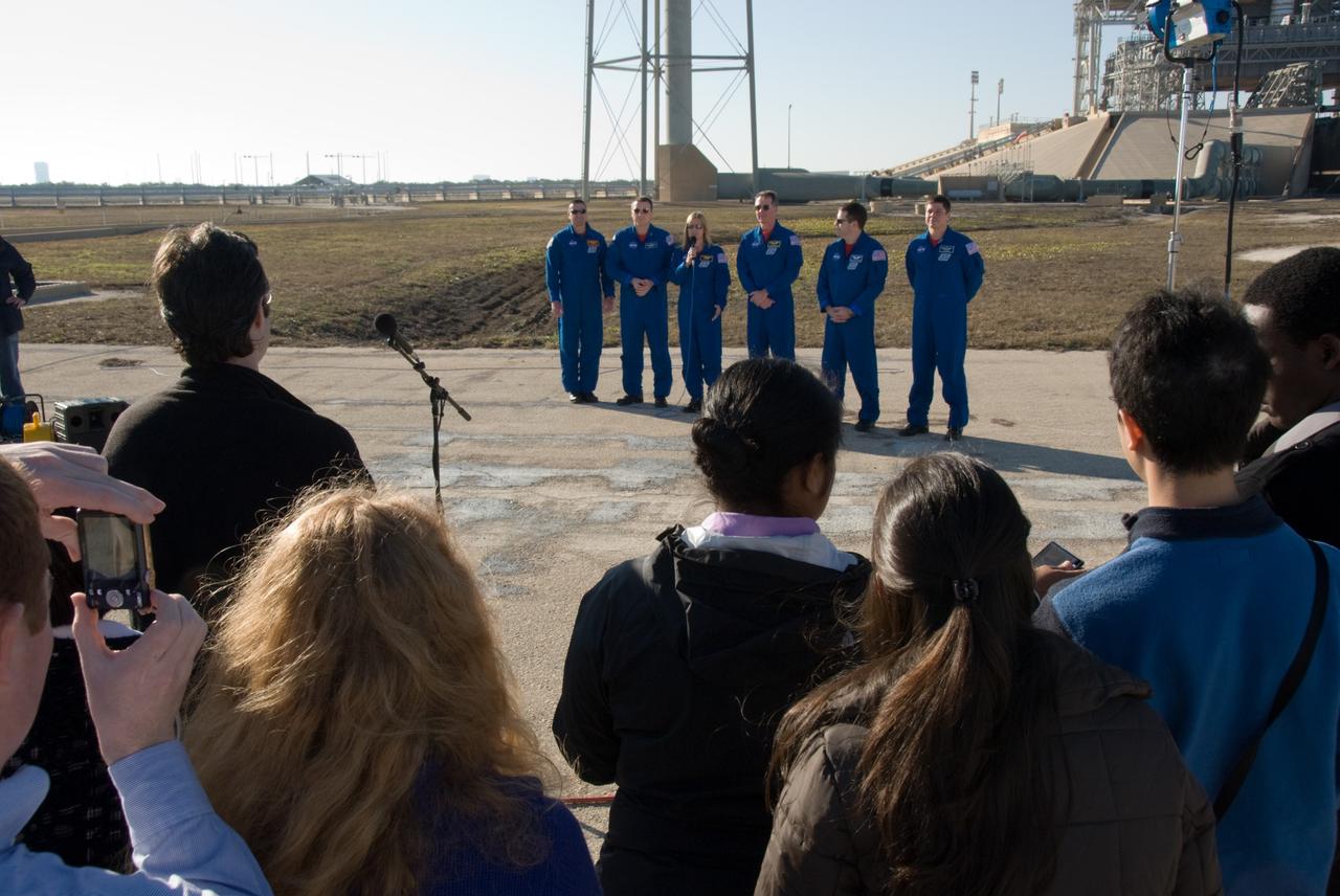 CAPE CANAVERAL, Fla. - At Launch Pad 39A at NASA's Kennedy Space Center in Florida, media representatives ask questions of the STS-130 crew during a question-and-answer session.  The astronauts are, from left, Commander George Zamka; Pilot Terry Virts; and Mission Specialists Kathryn Hire, Stephen Robinson, Nicholas Patrick and Robert Behnken.    The crew members of space shuttle Endeavour's upcoming mission are at Kennedy for training related to their launch dress rehearsal, the Terminal Countdown Demonstration Test.  The primary payload on STS-130 is the International Space Station's Node 3, Tranquility, a pressurized module that will provide room for many of the station's life support systems. Attached to one end of Tranquility is a cupola, a unique work area with six windows on its sides and one on top.  Endeavour's launch is targeted for Feb. 7.  For information on the STS-130 mission and crew, visit http://www.nasa.gov/mission_pages/shuttle/shuttlemissions/sts130/index.html.  Photo credit: NASA/Kim Shiflett