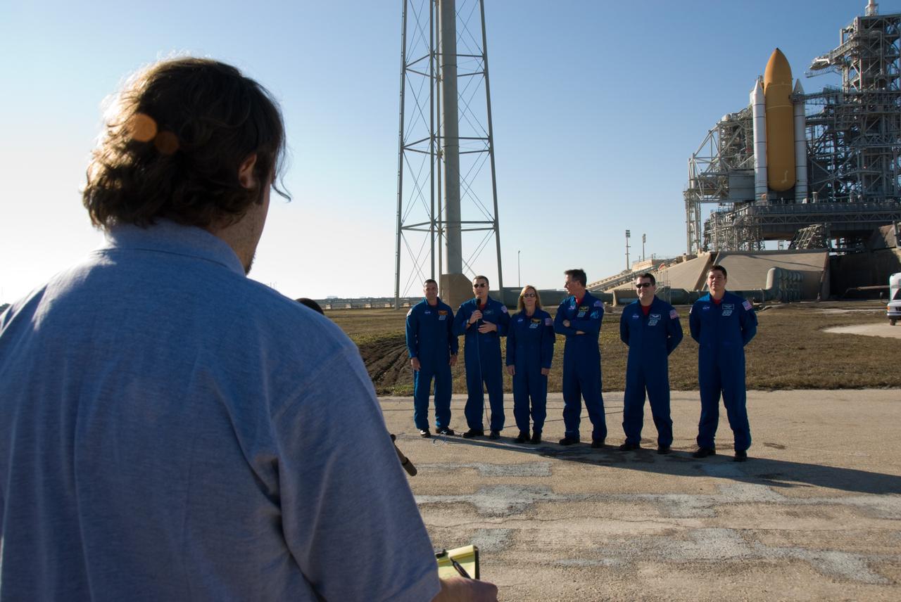 CAPE CANAVERAL, Fla. - At NASA's Kennedy Space Center in Florida, media representatives are given the opportunity to interview the STS-130 crew during a question-and-answer session at Launch Pad 39A.  The astronauts are, from left, Commander George Zamka; Pilot Terry Virts; and Mission Specialists Kathryn Hire, Stephen Robinson, Nicholas Patrick and Robert Behnken.    The crew members of space shuttle Endeavour's upcoming mission are at Kennedy for training related to their launch dress rehearsal, the Terminal Countdown Demonstration Test.  The primary payload on STS-130 is the International Space Station's Node 3, Tranquility, a pressurized module that will provide room for many of the station's life support systems. Attached to one end of Tranquility is a cupola, a unique work area with six windows on its sides and one on top.  Endeavour's launch is targeted for Feb. 7.  For information on the STS-130 mission and crew, visit http://www.nasa.gov/mission_pages/shuttle/shuttlemissions/sts130/index.html.  Photo credit: NASA/Kim Shiflett