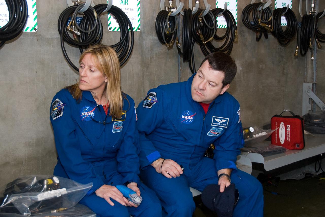 CAPE CANAVERAL, Fla. - On Launch Pad 39A at NASA's Kennedy Space Center in Florida, STS-130 Mission Specialists Kathryn Hire and Nicholas Patrick continue their emergency exit training in a bunker near the catch nets for the slidewire baskets at the base of the pad.  The bunker would provide a safe haven for the astronauts if evacuation of the pad were required.    The crew members of space shuttle Endeavour's upcoming mission are at Kennedy for training related to their launch dress rehearsal, the Terminal Countdown Demonstration Test.  The primary payload on STS-130 is the International Space Station's Node 3, Tranquility, a pressurized module that will provide room for many of the station's life support systems. Attached to one end of Tranquility is a cupola, a unique work area with six windows on its sides and one on top.  Endeavour's launch is targeted for Feb. 7.  For information on the STS-130 mission and crew, visit http://www.nasa.gov/mission_pages/shuttle/shuttlemissions/sts130/index.html.  Photo credit: NASA/Kim Shiflett