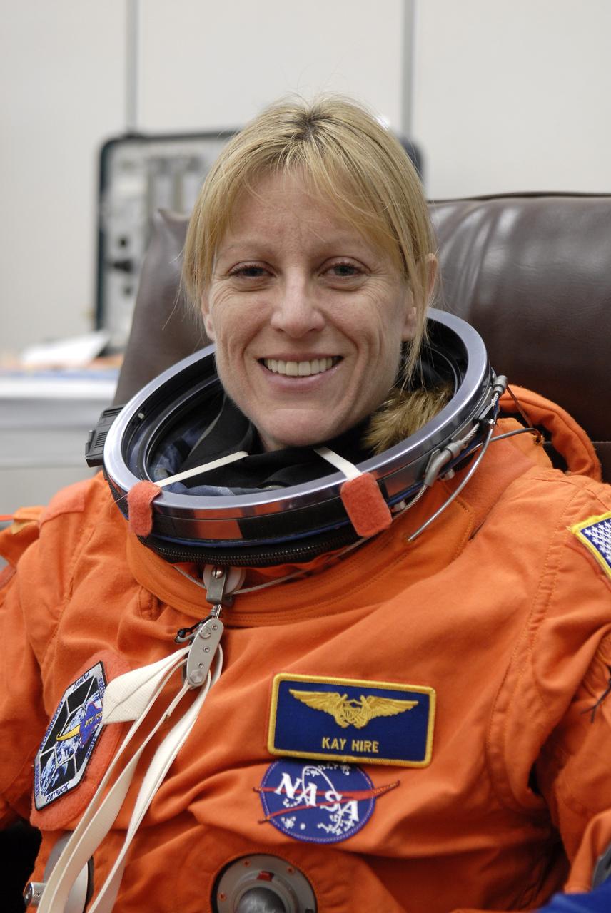 CAPE CANAVERAL, Fla. - In the Operations and Checkout Building at NASA's Kennedy Space Center in Florida, members of space shuttle Endeavour's STS-130 crew put on their launch-and-entry suits before heading to the Astrovan for the ride to Launch Pad 39A. The crew is participating in a dress rehearsal for their upcoming launch, known as the Terminal Countdown Demonstration Test. Making her second spaceflight on STS-130 is Mission Specialist Kathryn Hire, seen here. The primary payload for the STS-130 mission is the International Space Station's Tranquility node, a pressurized module that will provide room for many of the station's life support systems. Attached to one end of Tranquility is a cupola, a unique work area with six windows on its sides and one on top. The cupola resembles a circular bay window and will provide a vastly improved view of the station's exterior. The multi-directional view will allow the crew to monitor spacewalks and docking operations, as well as provide a spectacular view of Earth and other celestial objects. The module was built in Turin, Italy, by Thales Alenia Space for the European Space Agency. Launch of STS-130 is targeted for Feb. 7. For information on the STS-130 mission and crew, visit http://www.nasa.gov/mission_pages/shuttle/shuttlemissions/sts130/index.html. Photo credit: NASA/Kim Shiflett