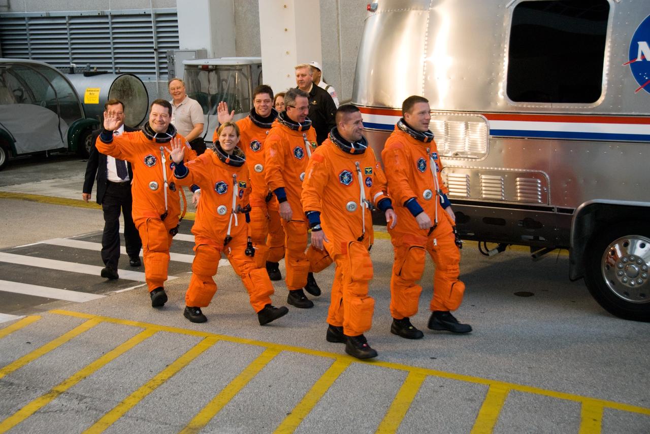 CAPE CANAVERAL, Fla. - At the Operations and Checkout Building at NASA's Kennedy Space Center in Florida, members of space shuttle Endeavour's STS-130 crew head for the Astrovan in their launch-and-entry suits for the ride to Launch Pad 39A. The crew is participating in a dress rehearsal for their upcoming launch, known as the Terminal Countdown Demonstration Test. From left are Mission Specialists Nicholas Patrick, Kathryn Hire, Robert Behnken and Stephen Robinson; Commander George Zamka; and Pilot Terry Virts. The primary payload for the STS-130 mission is the International Space Station's Tranquility node, a pressurized module that will provide room for many of the station's life support systems. Attached to one end of Tranquility is a cupola, a unique work area with six windows on its sides and one on top. The cupola resembles a circular bay window and will provide a vastly improved view of the station's exterior. The multi-directional view will allow the crew to monitor spacewalks and docking operations, as well as provide a spectacular view of Earth and other celestial objects. The module was built in Turin, Italy, by Thales Alenia Space for the European Space Agency. Launch of STS-130 is targeted for Feb. 7. For information on the STS-130 mission and crew, visit http://www.nasa.gov/mission_pages/shuttle/shuttlemissions/sts130/index.html. Photo credit: NASA/Kim Shiflett