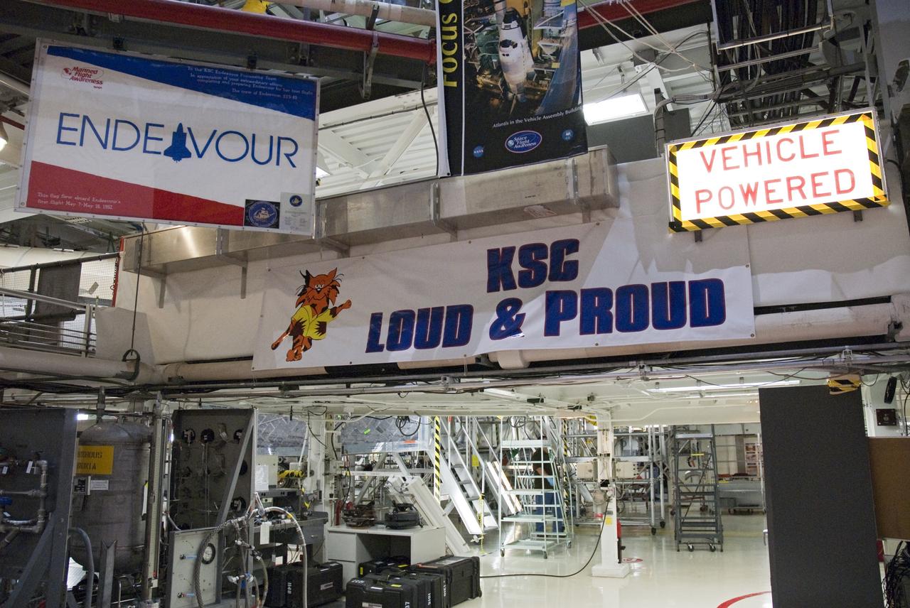 CAPE CANAVERAL, Fla. -- Signs in Orbiter Processing Facility-2 at NASA's Kennedy Space Center in Florida, reflect the pride and dedication workers have for space shuttle Endeavour and the Space Shuttle Program. As the final planned mission of the Space Shuttle Program, Endeavour and its crew will deliver the Alpha Magnetic Spectrometer, as well as critical spare components to the station on the STS-134 mission targeted for launch Feb. 26, 2011. For more information visit, http://www.nasa.gov/mission_pages/shuttle/shuttlemissions/sts134/index.html. Photo credit: NASA/Frankie Martin